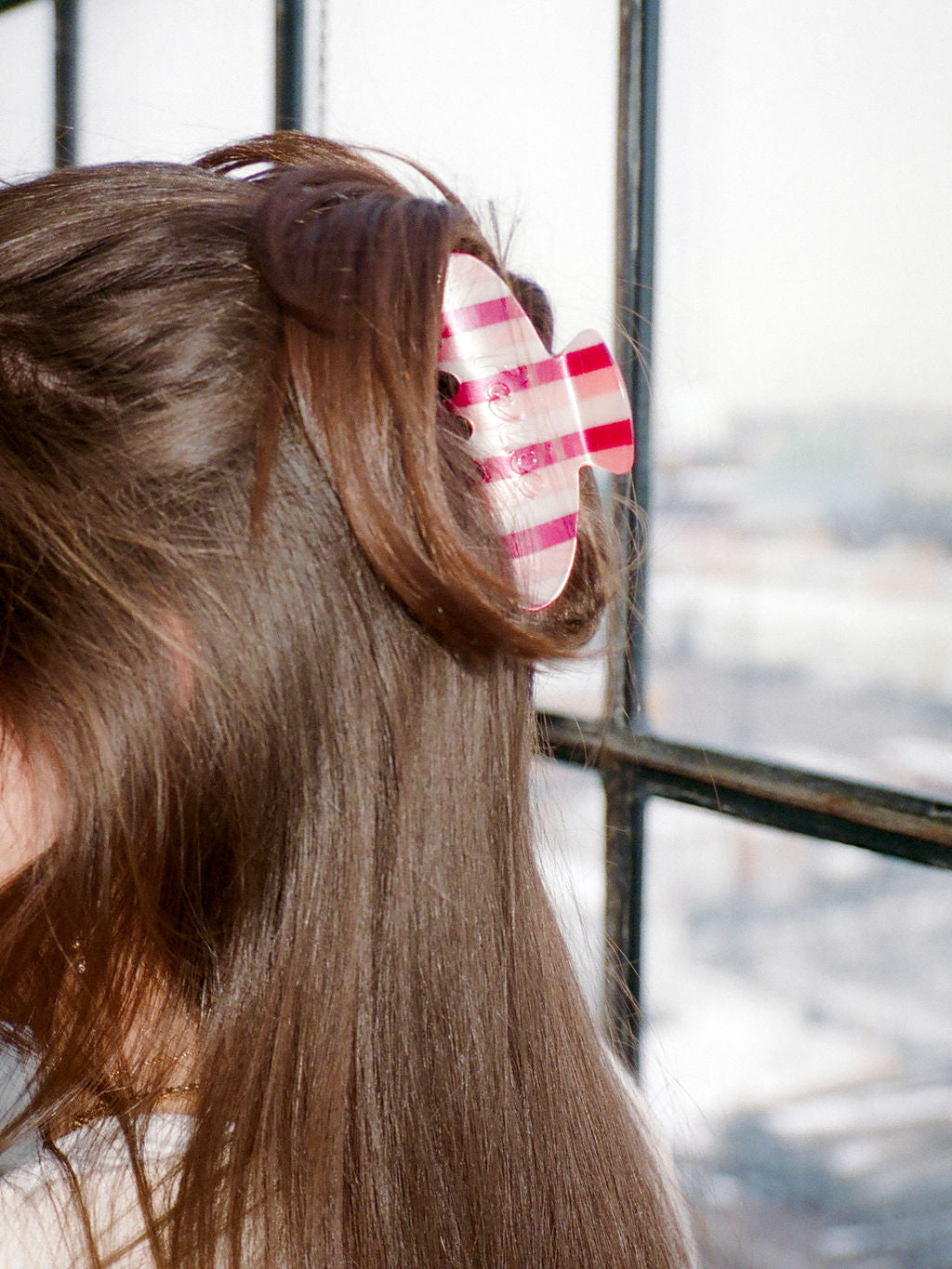 girl wearing valentines stripe claw clip -valentines stripe