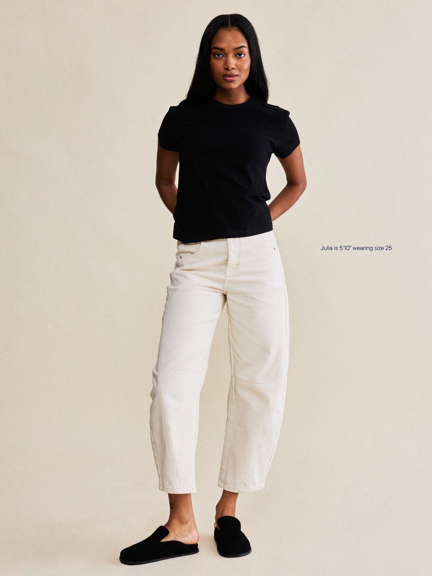 girl wearing horseshoe jeans -cream
