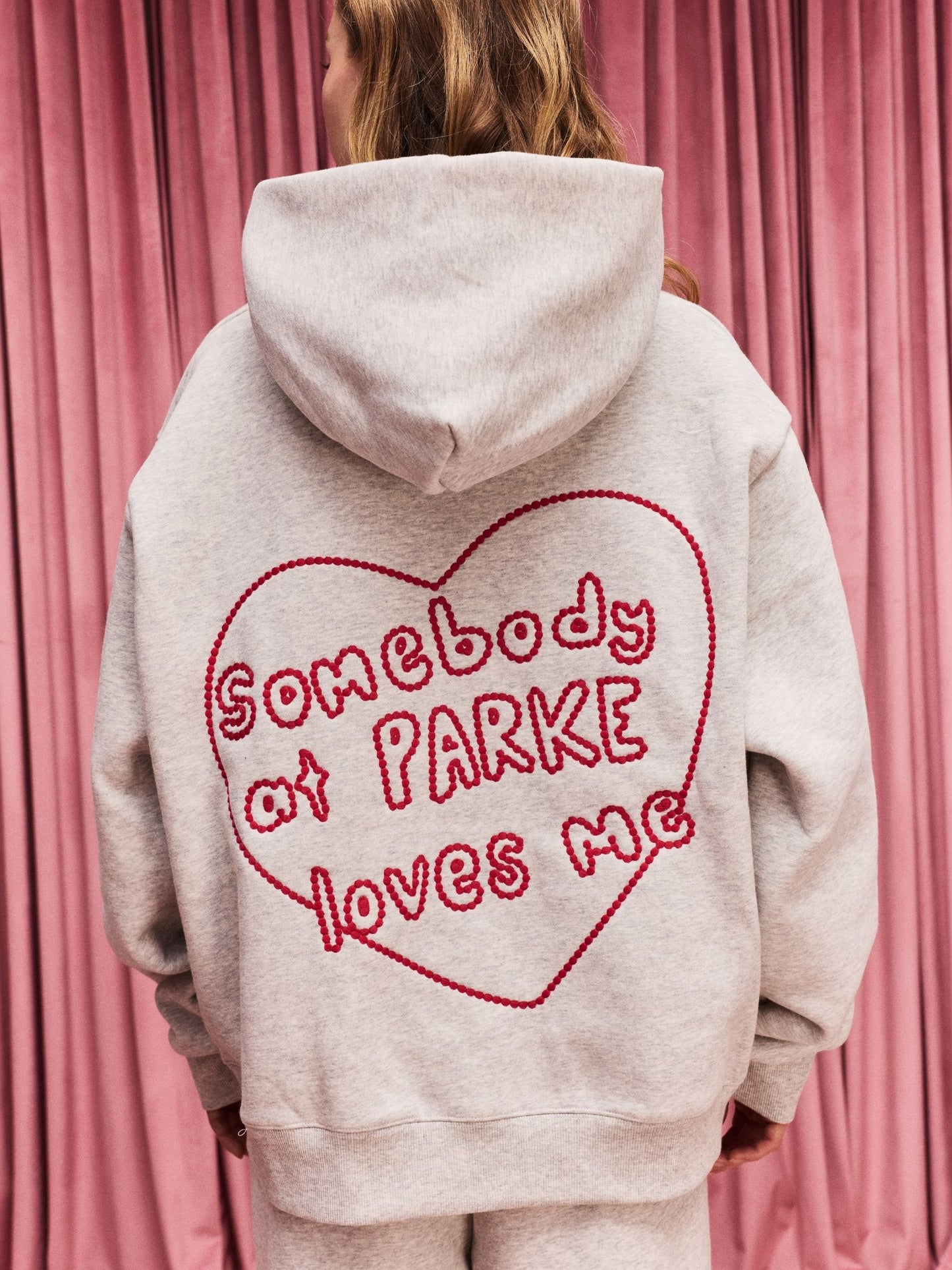 girl wearing Somebody Loves Me Hoodie -classic grey