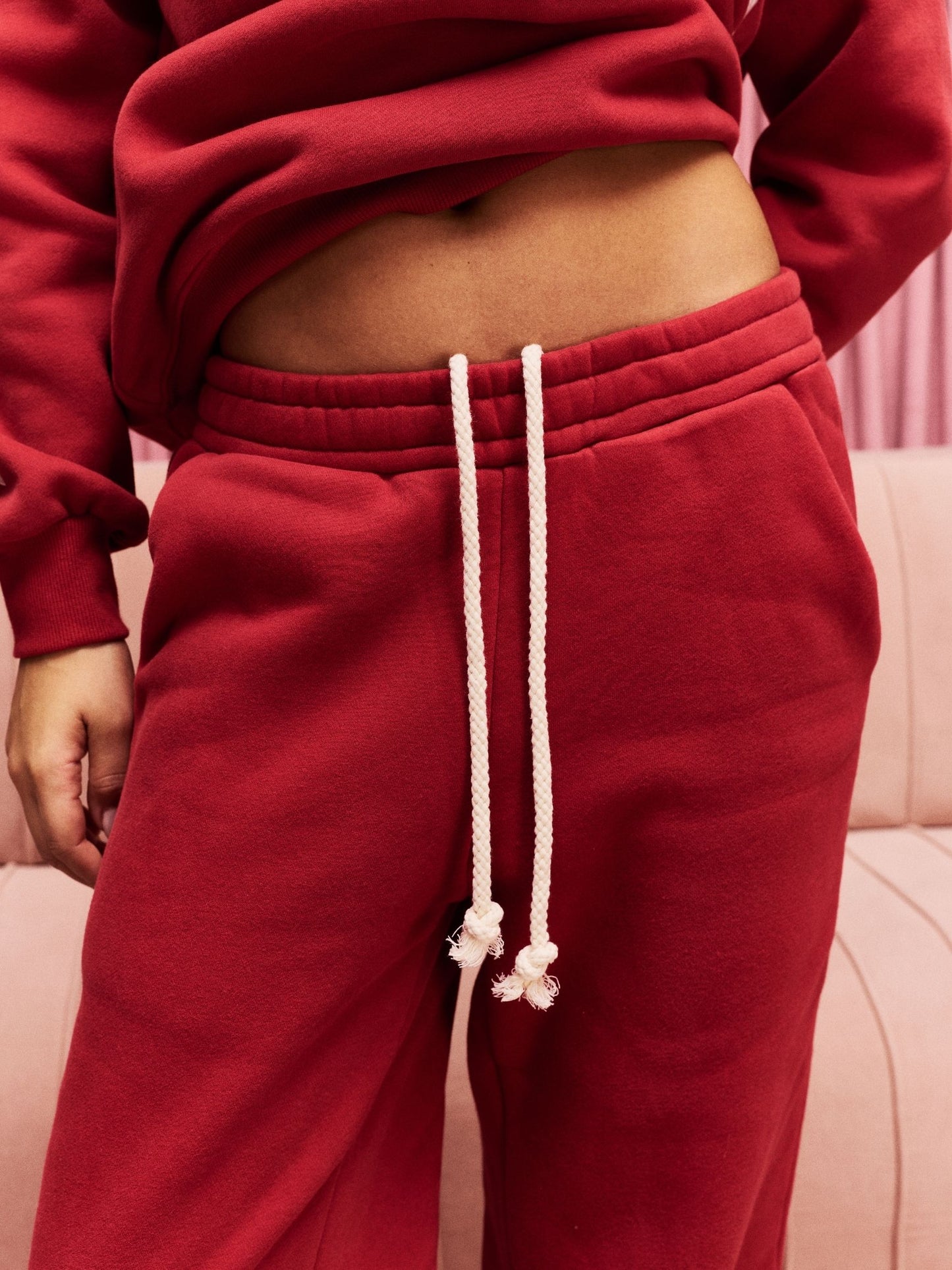 girl wearing Drawstring Unisex Sweatpants -crimson