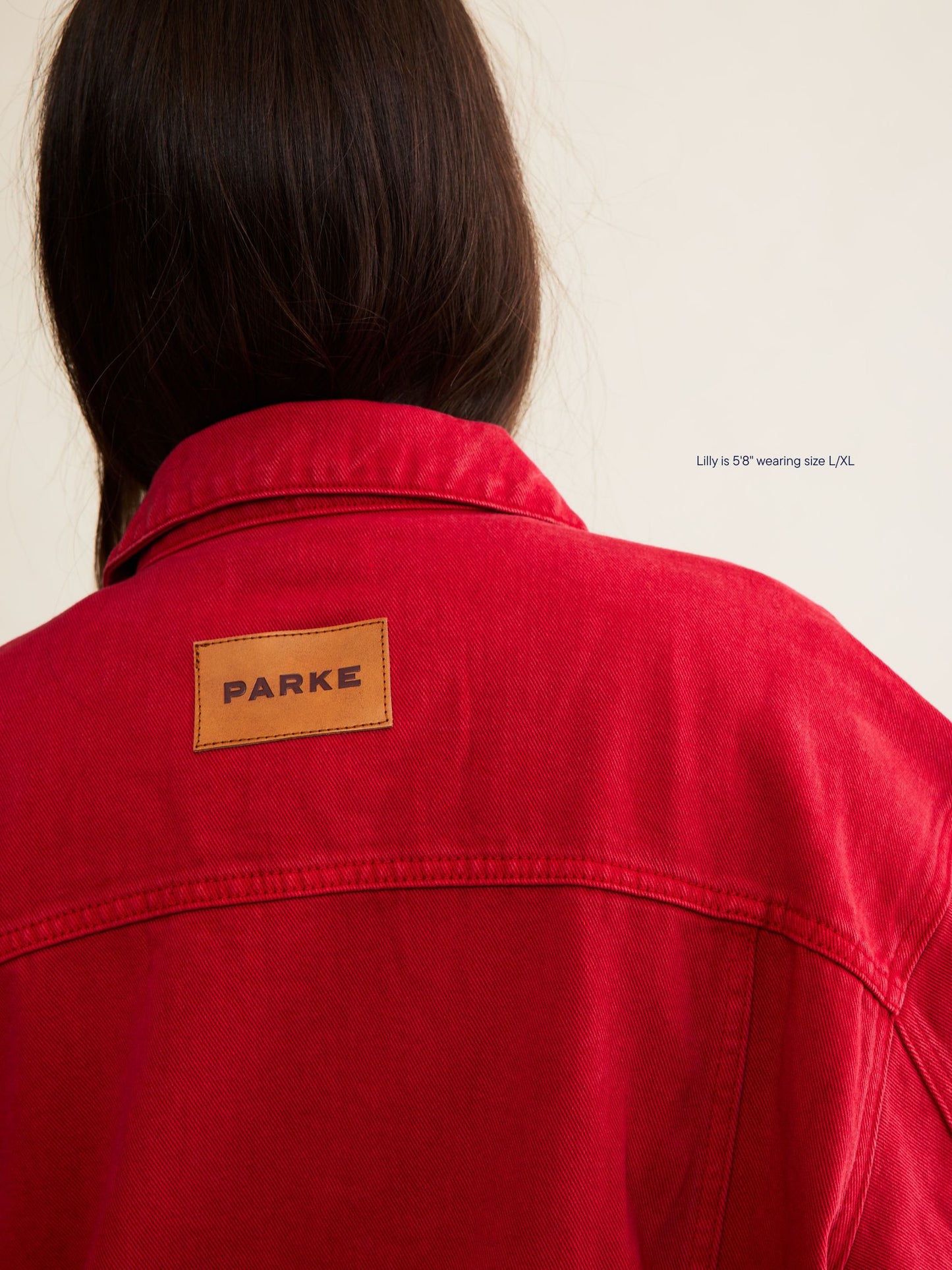 vintage wash girl wearing oversized denim jacket -washed red