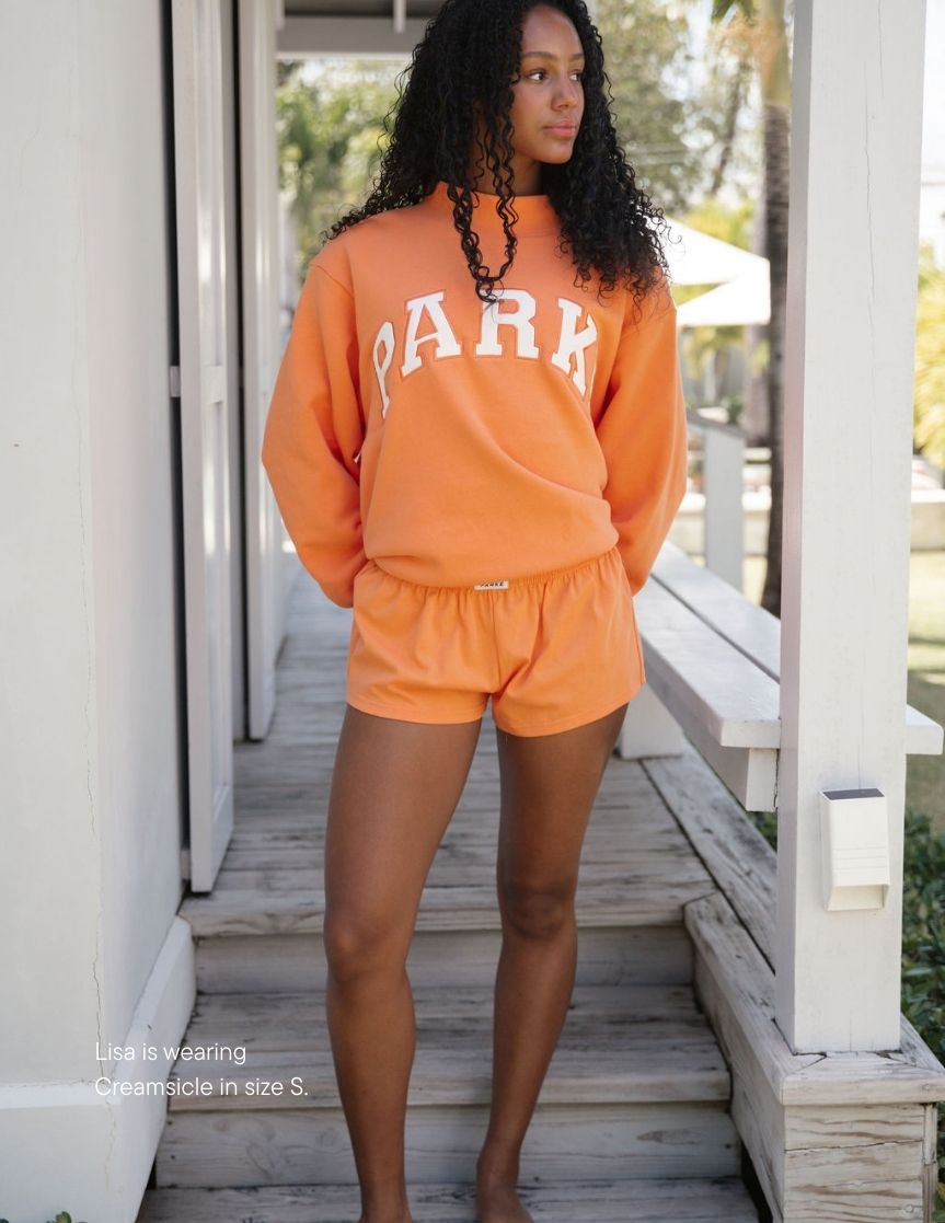 girl wearing cotton boxer shorts -creamsicle