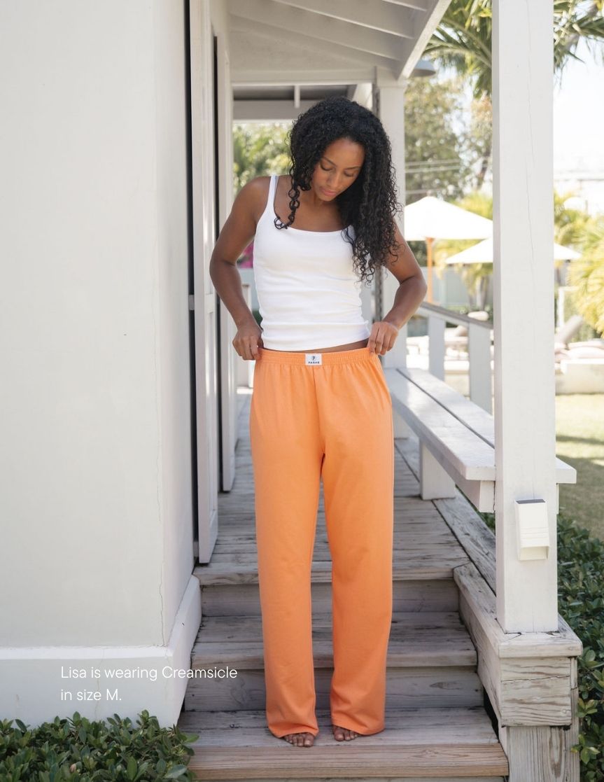 girl wearing cotton boxer pants -creamsicle