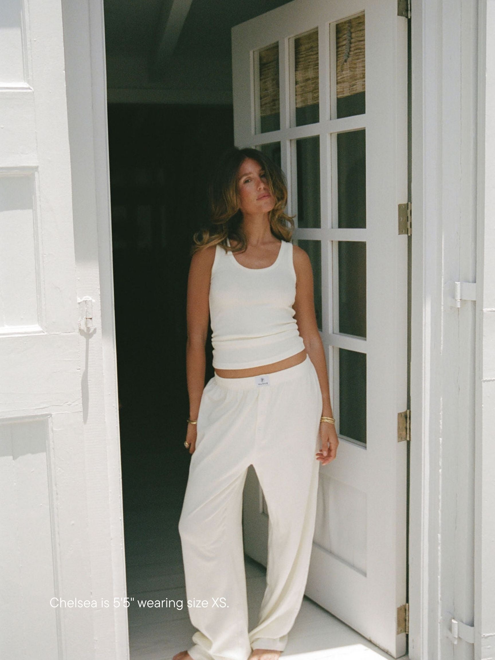 girl wearing pointelle pants -cream