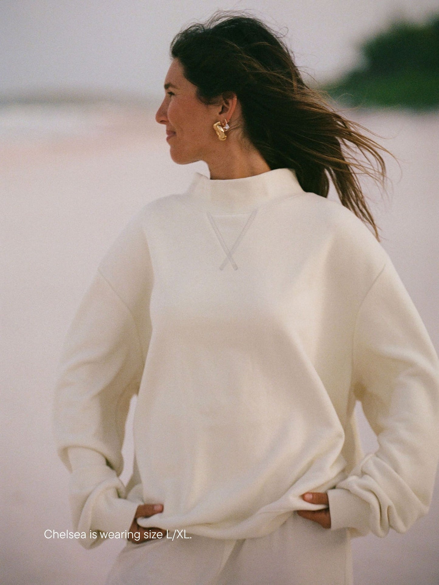 girl wearing heritage classic mockneck -cream