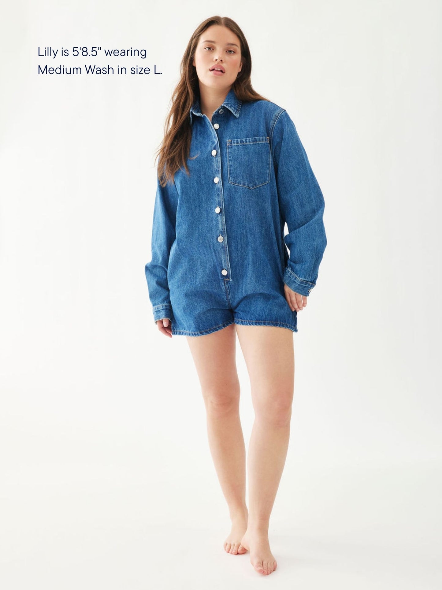 girl wearing long sleeve denim romper -medium wash