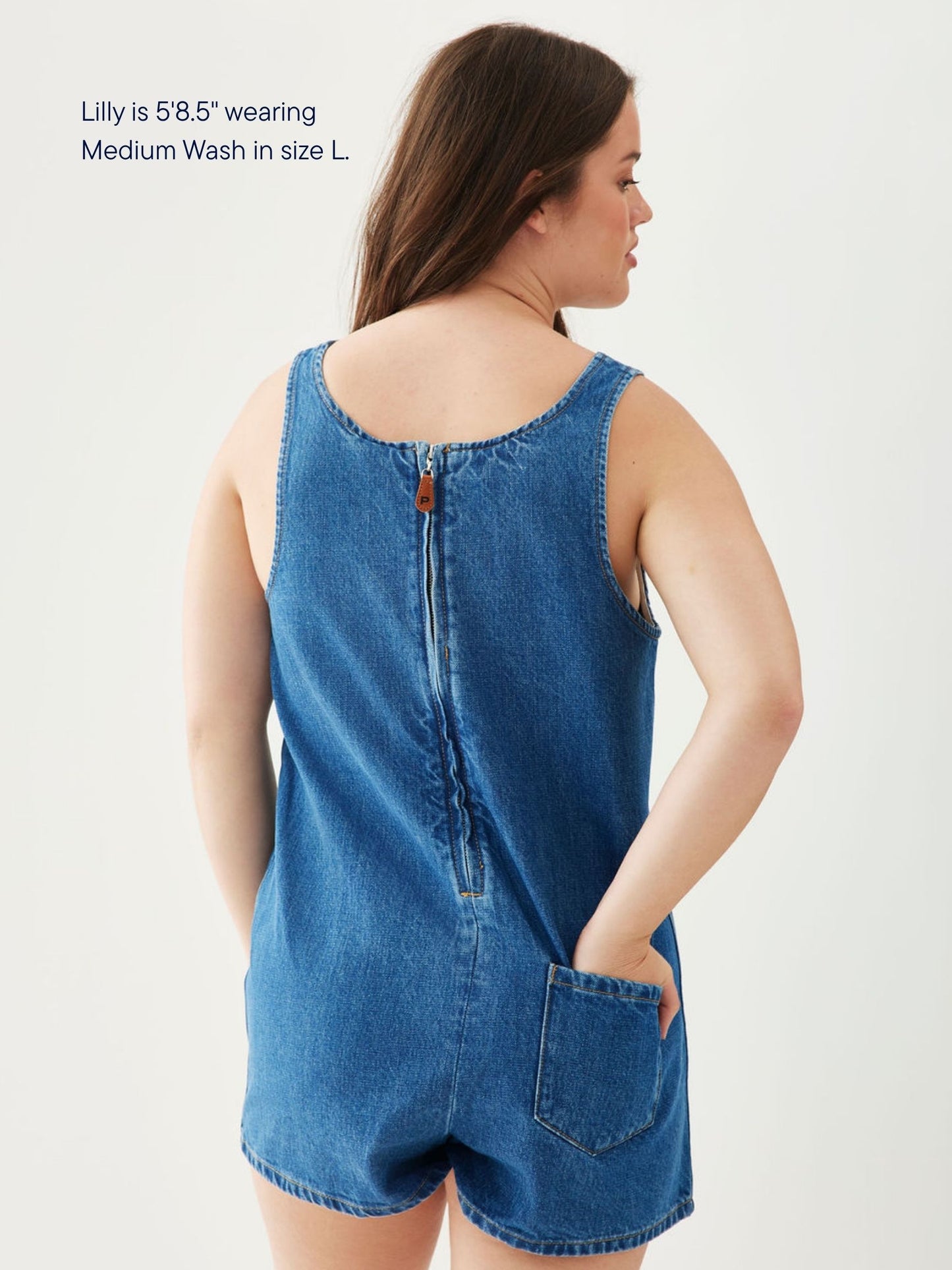 girl wearing tank top denim romper -med wash