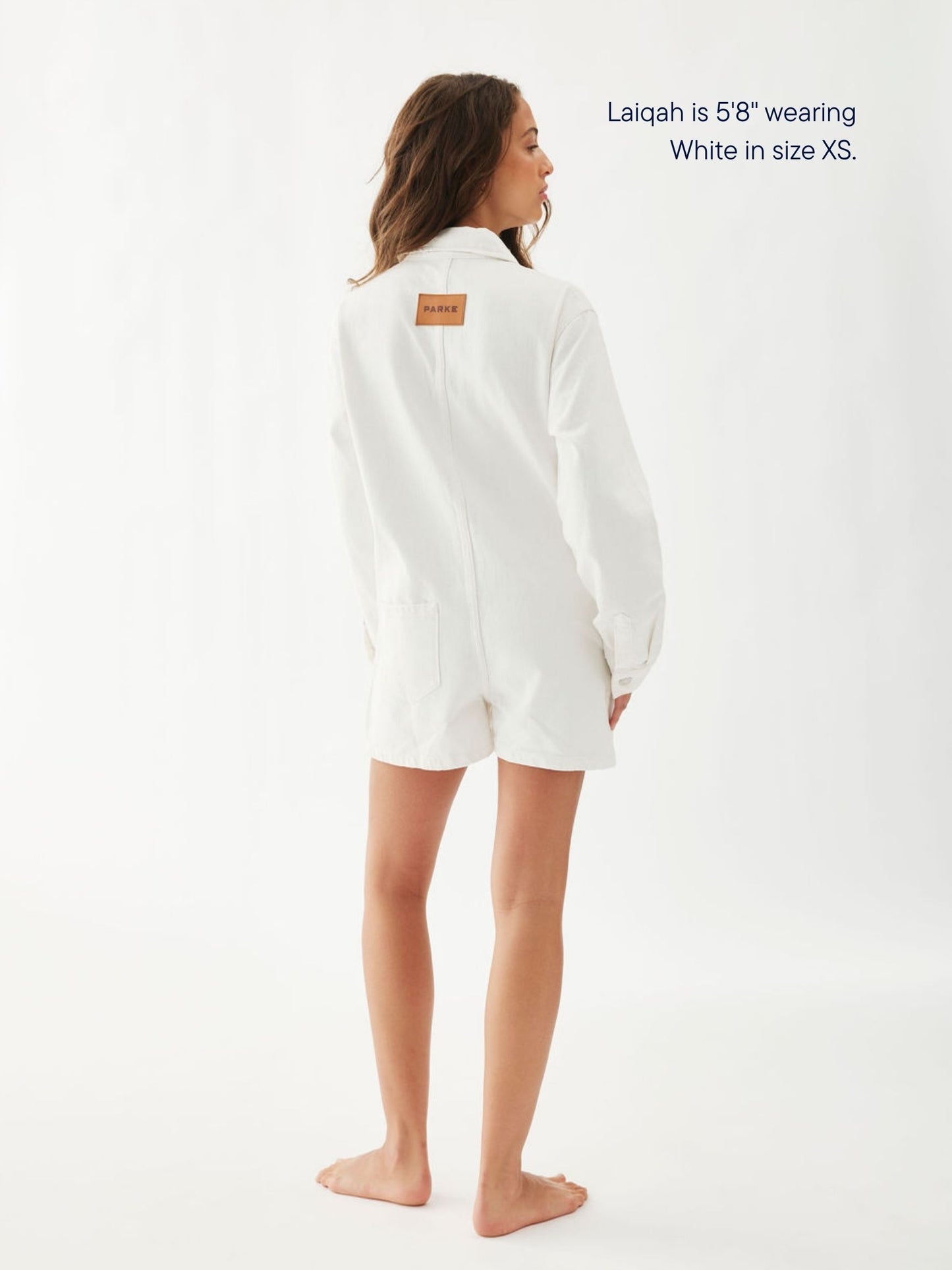 girl wearing long sleeve denim romper -white