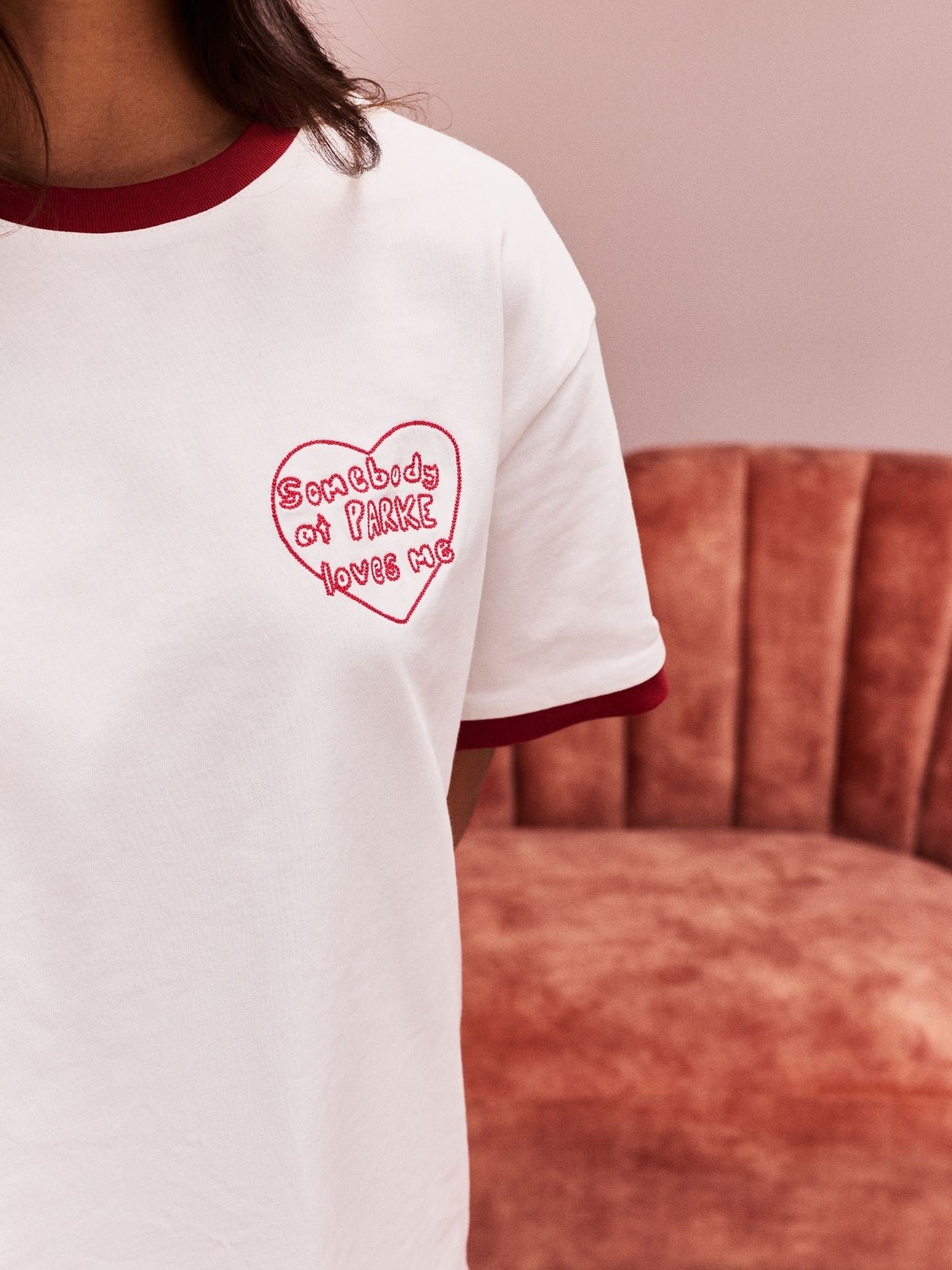 girl wearing Somebody Loves Me T-Shirt -white