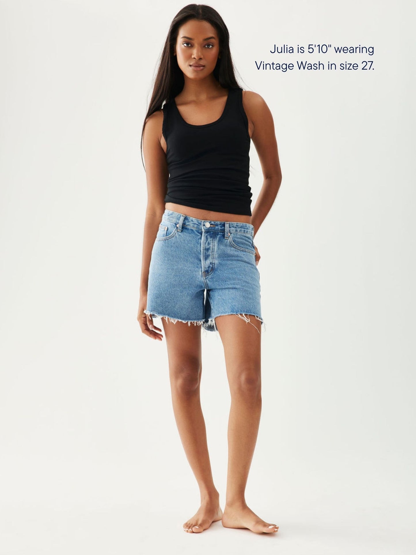 girl wearing long baggy shorts -vintage wash