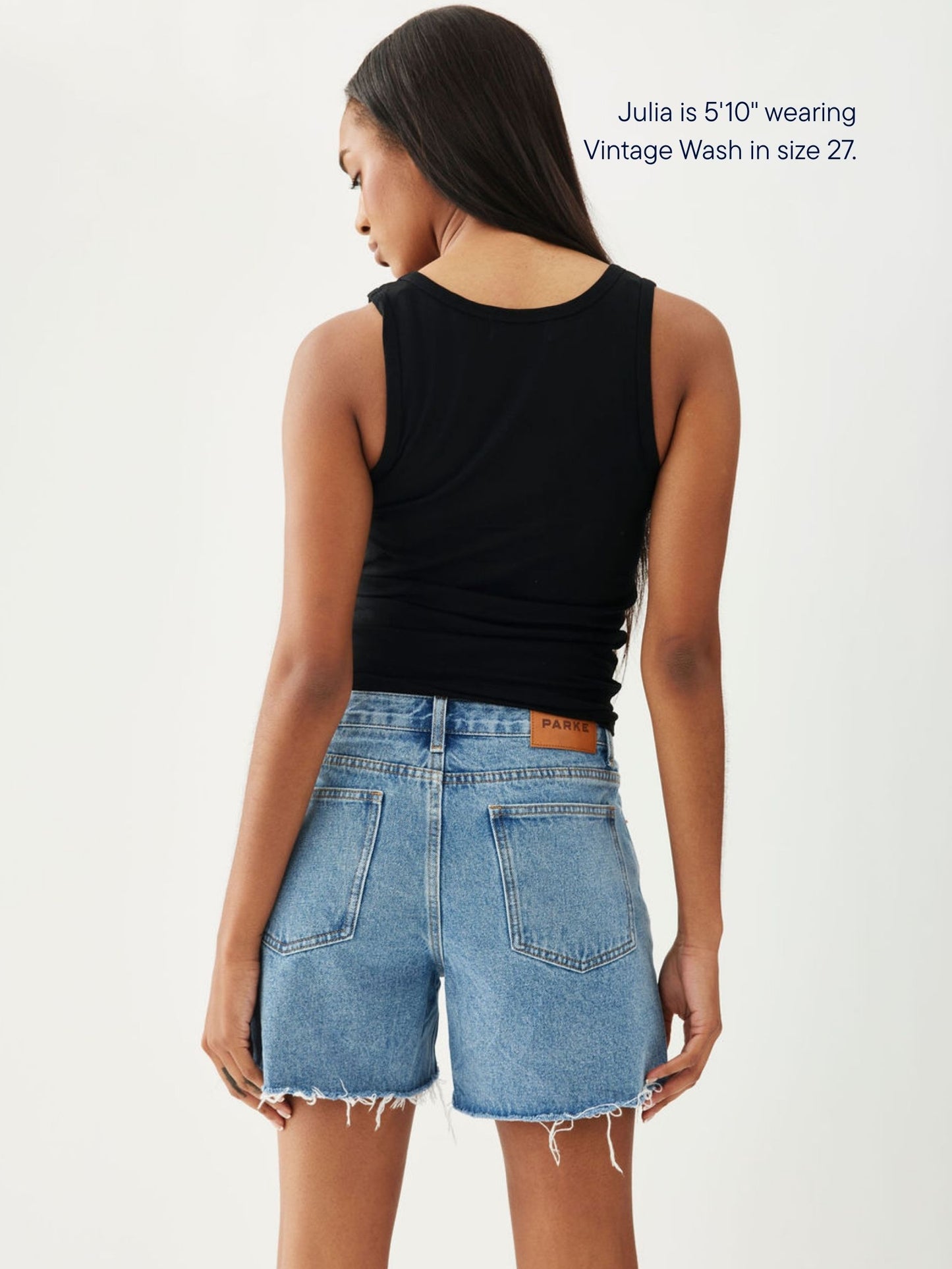 girl wearing long baggy shorts -vintage wash