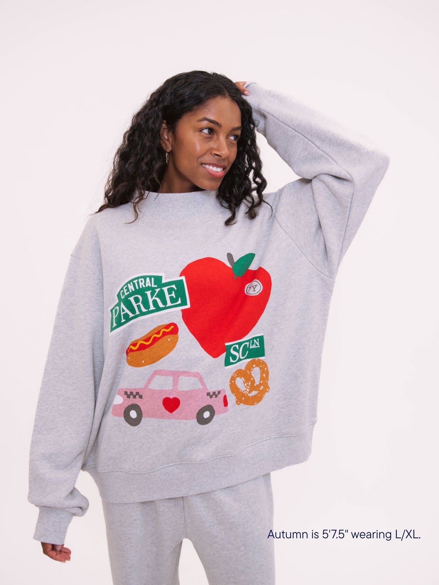 girl wearing parke x scl graphic mocneck -heather grey