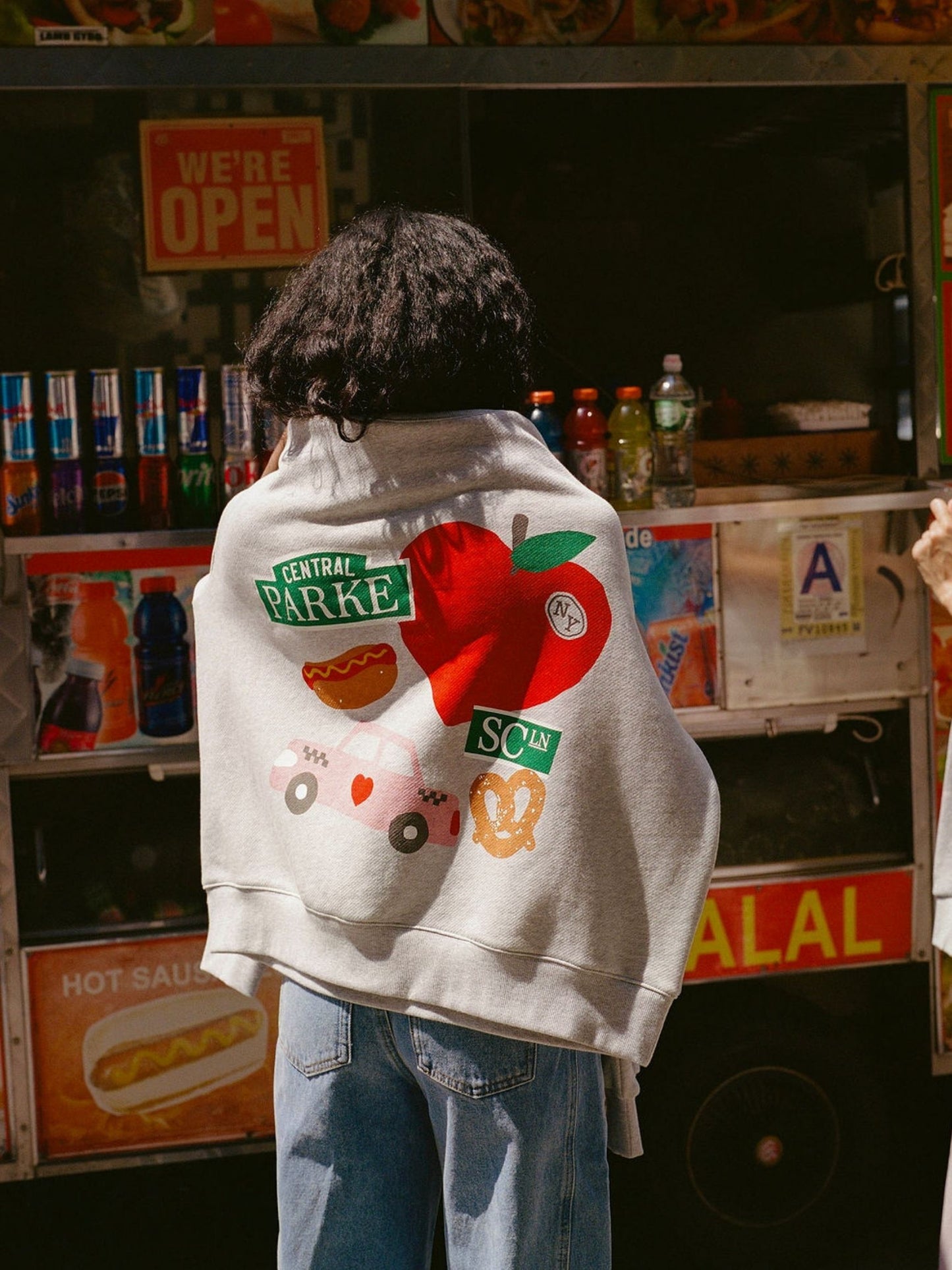 girl wearing parke x scl graphic mocneck -heather grey