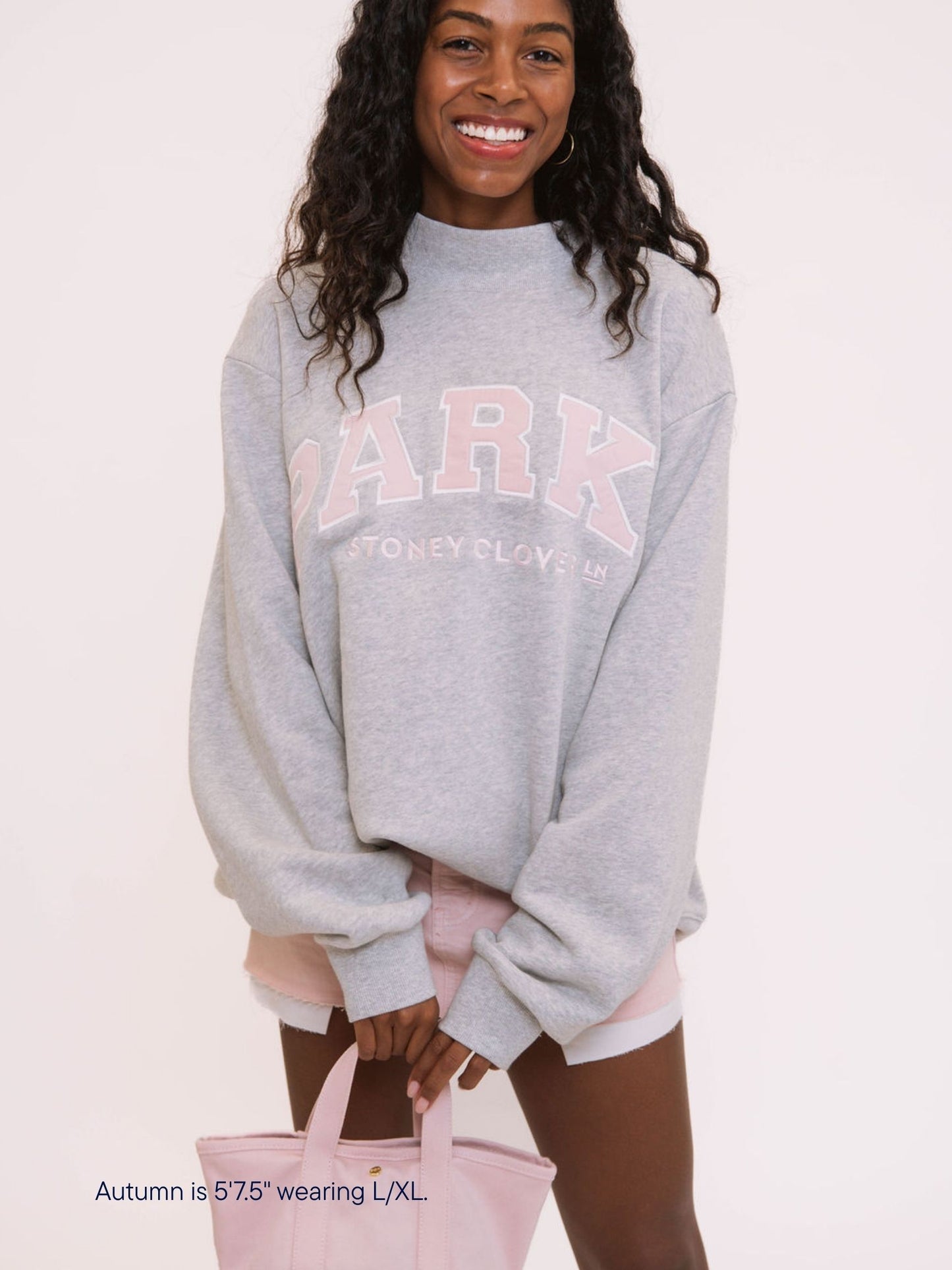 girl wearing parke x scl varsity mockneck -classic grey + pink