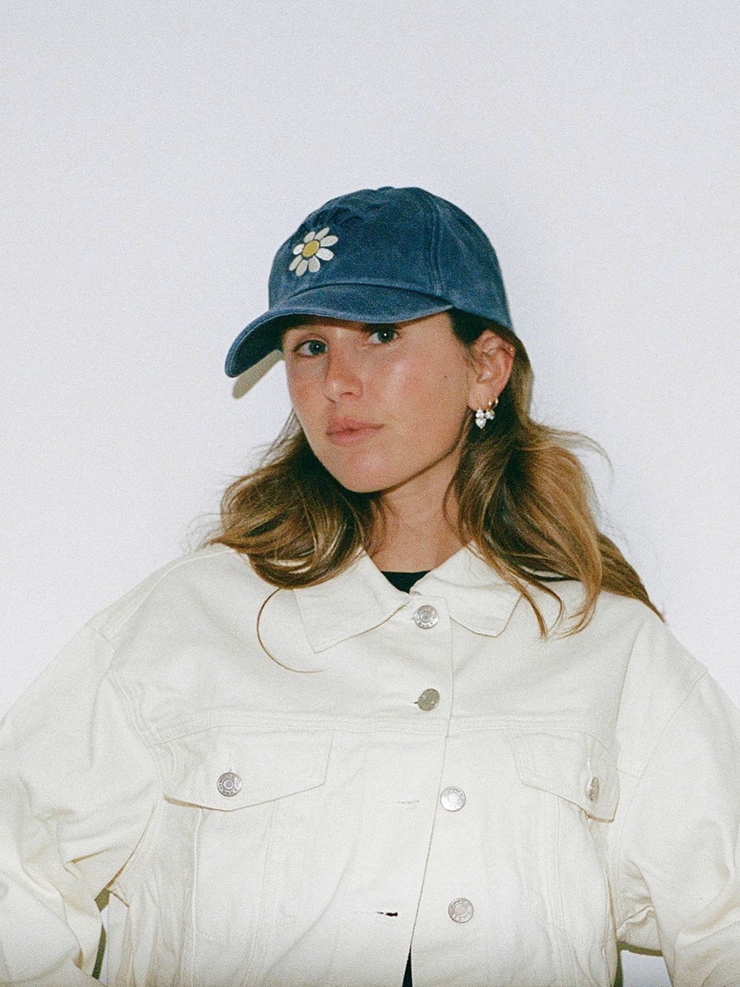 girl wearing flower hat -navy