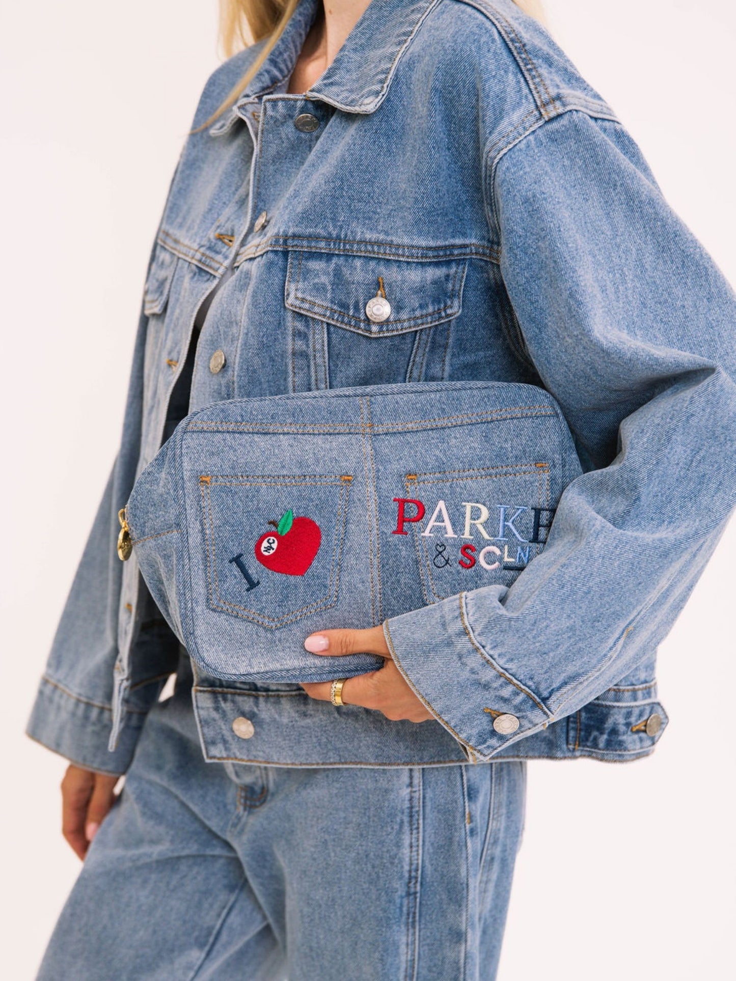girl holding SCL x Parke Large Pouch flat -vintage wash