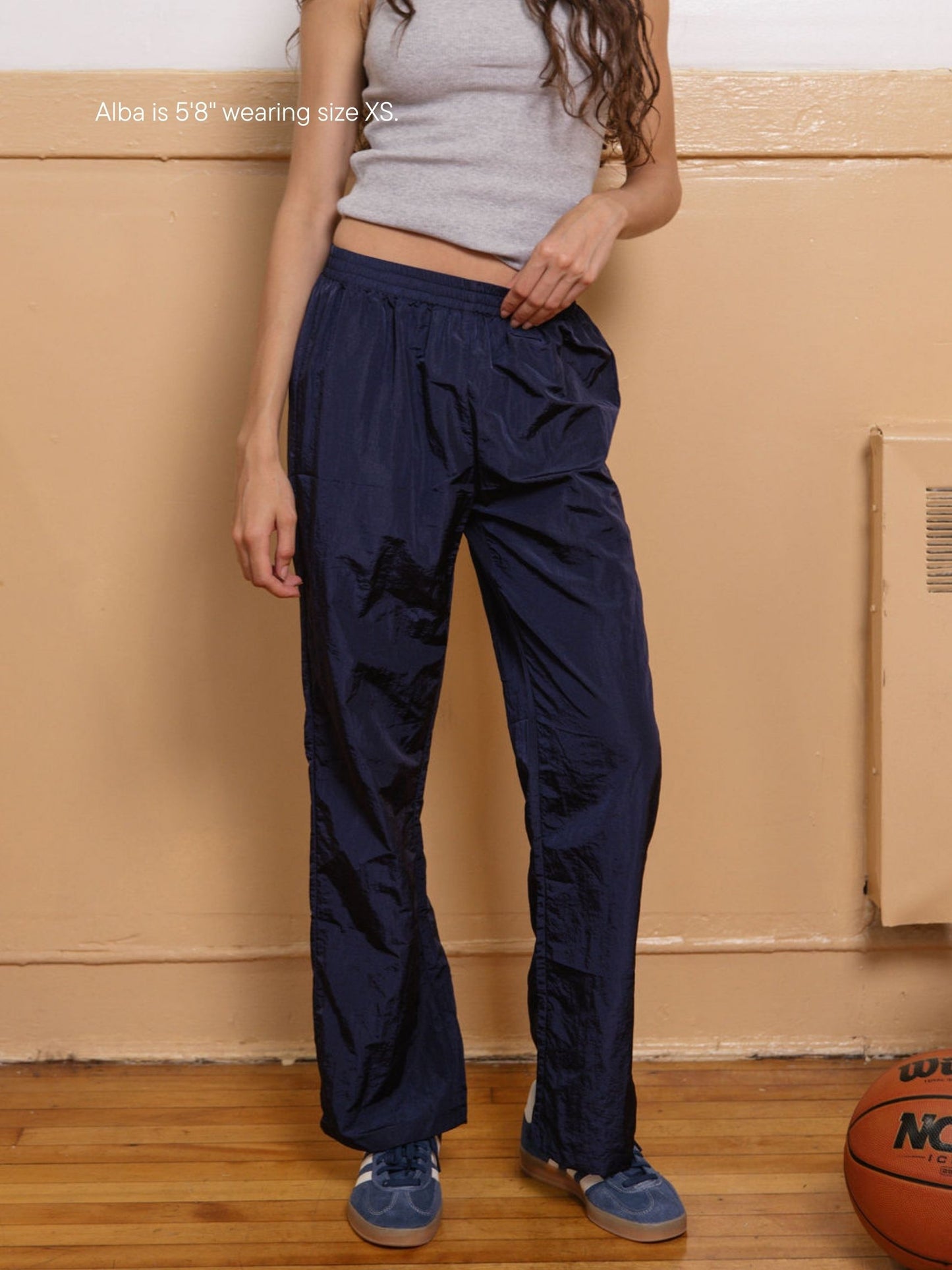 girl wearing nylon pants -navy