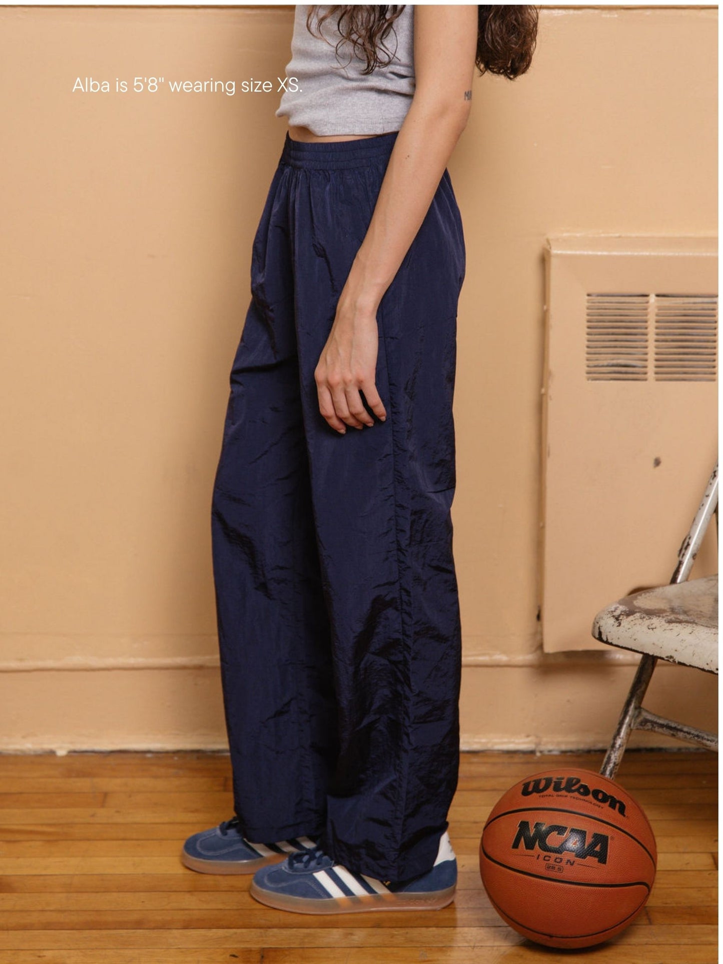 girl wearing nylon pants -navy