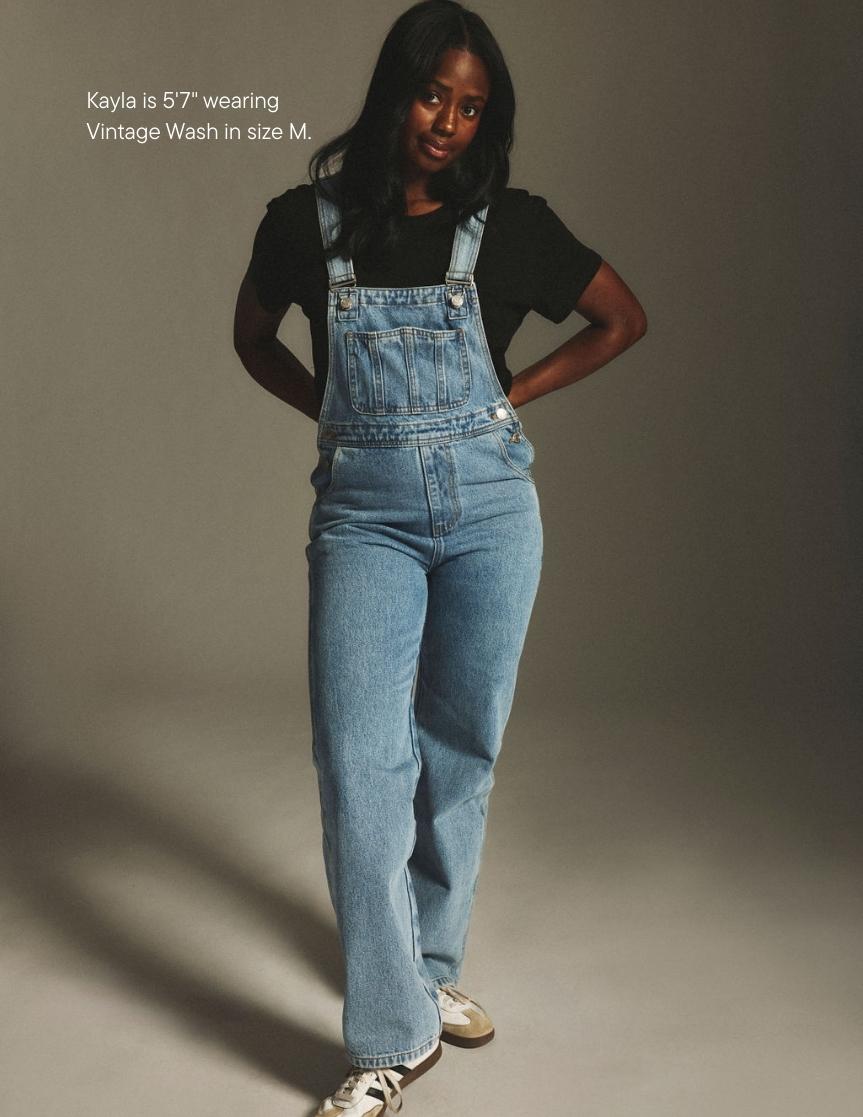 girl wearing denim overalls -vintage wash