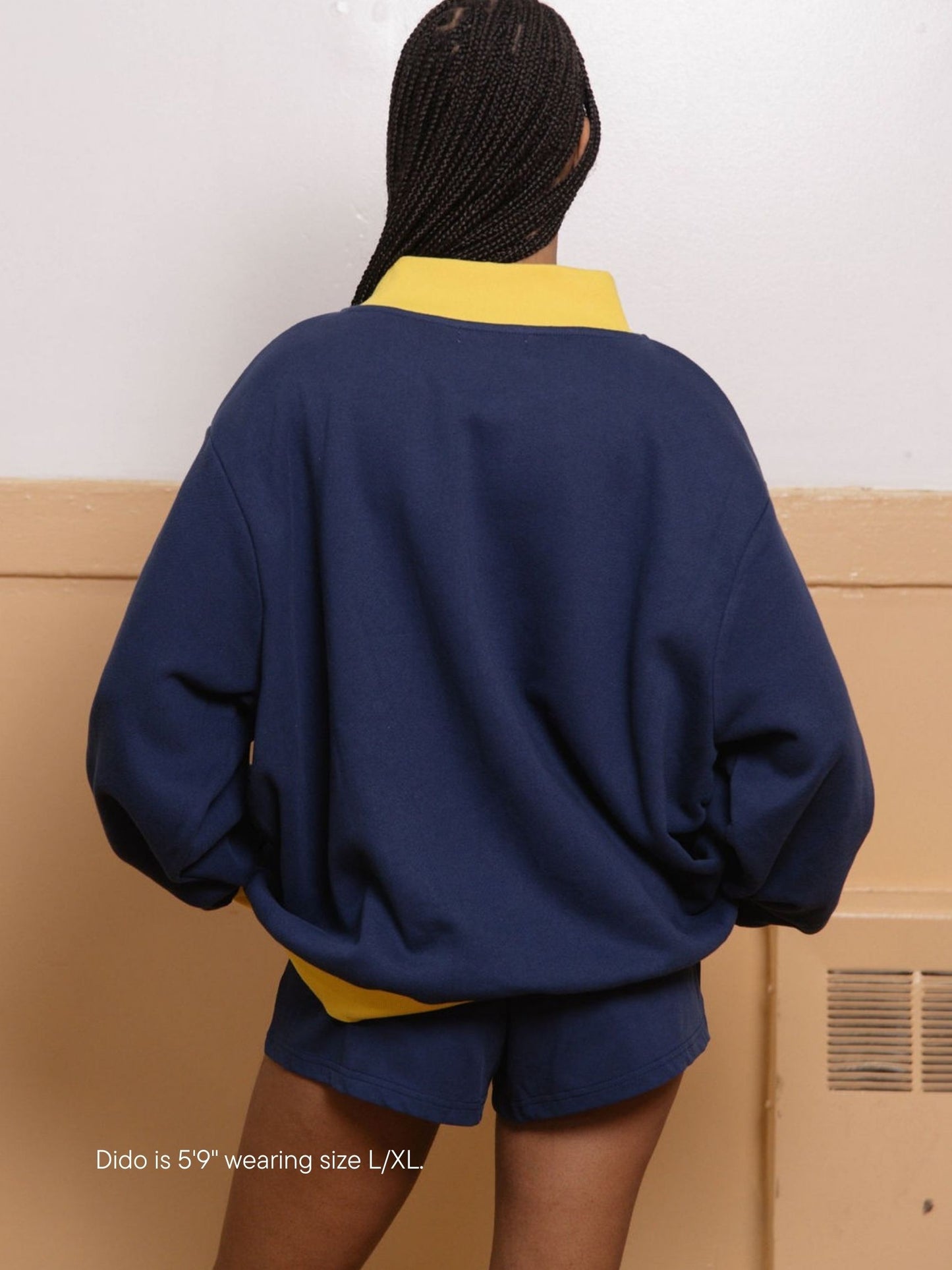 girl wearing two tone varsity mockneck -denim + maize