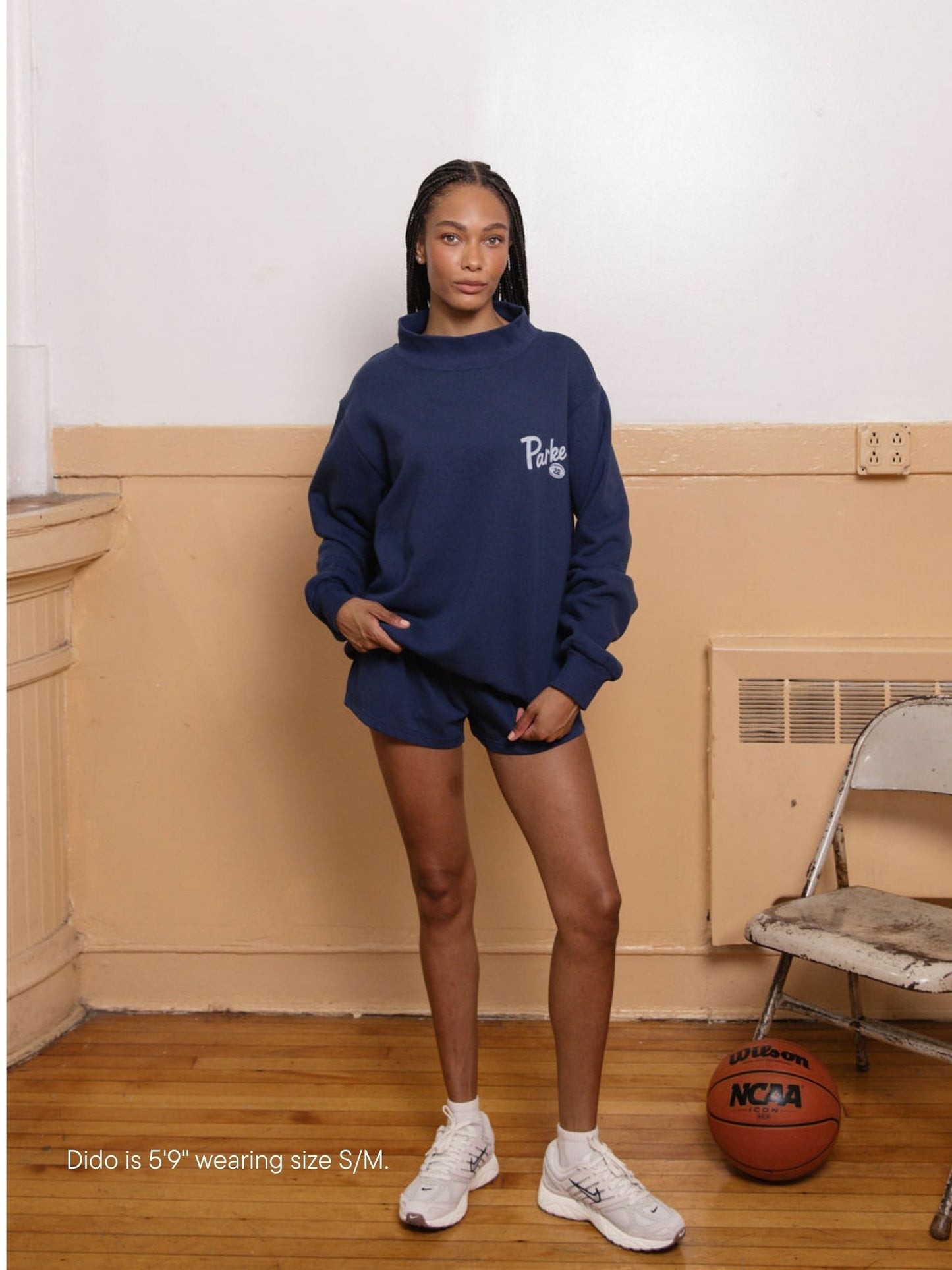 girl wearing kick off mockneck -denim