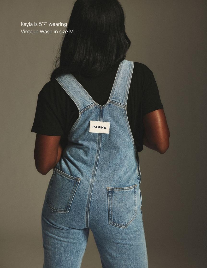 girl wearing denim overalls -vintage wash