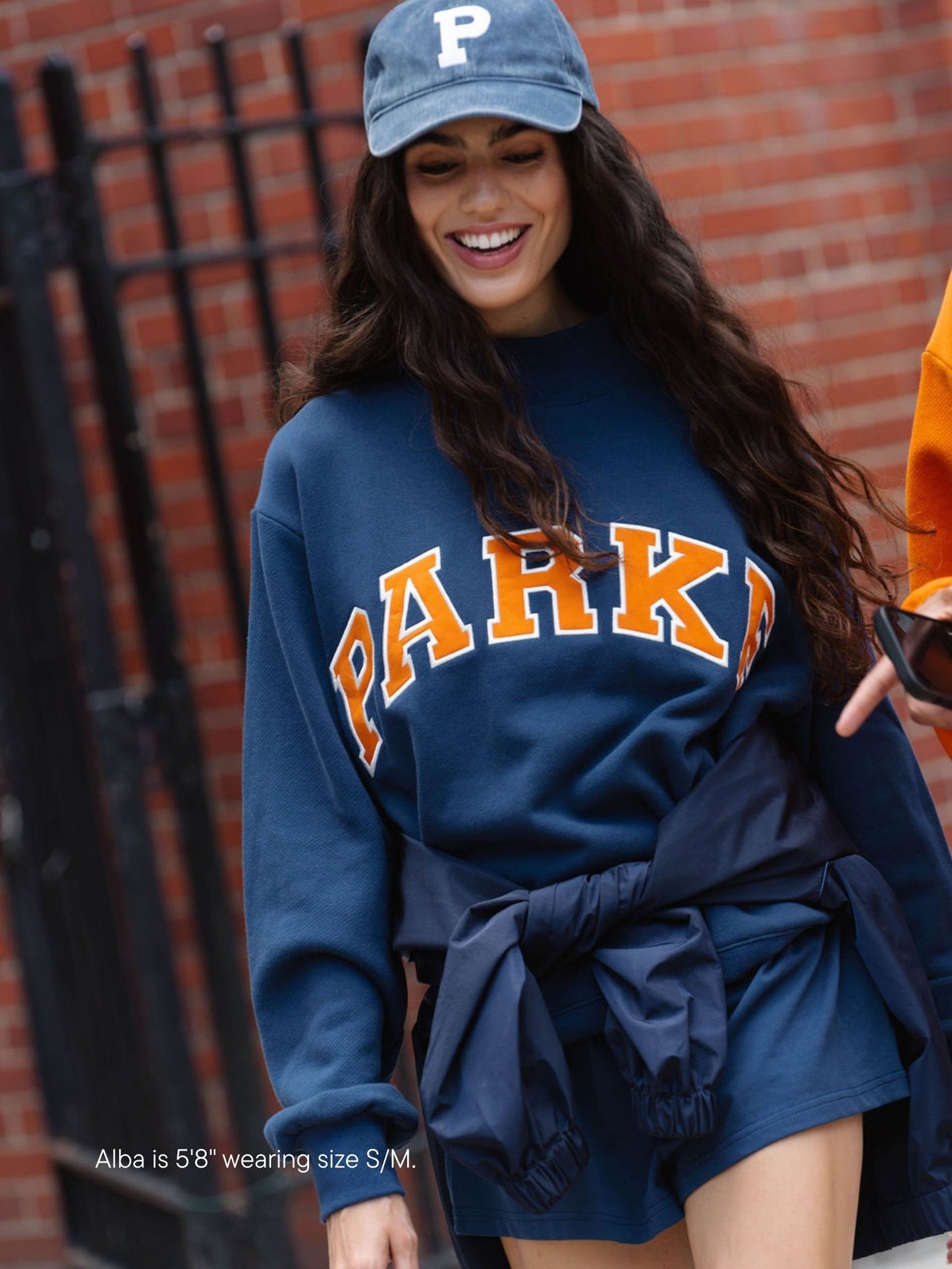 girl wearing back to school varsity mockneck -denim + amber