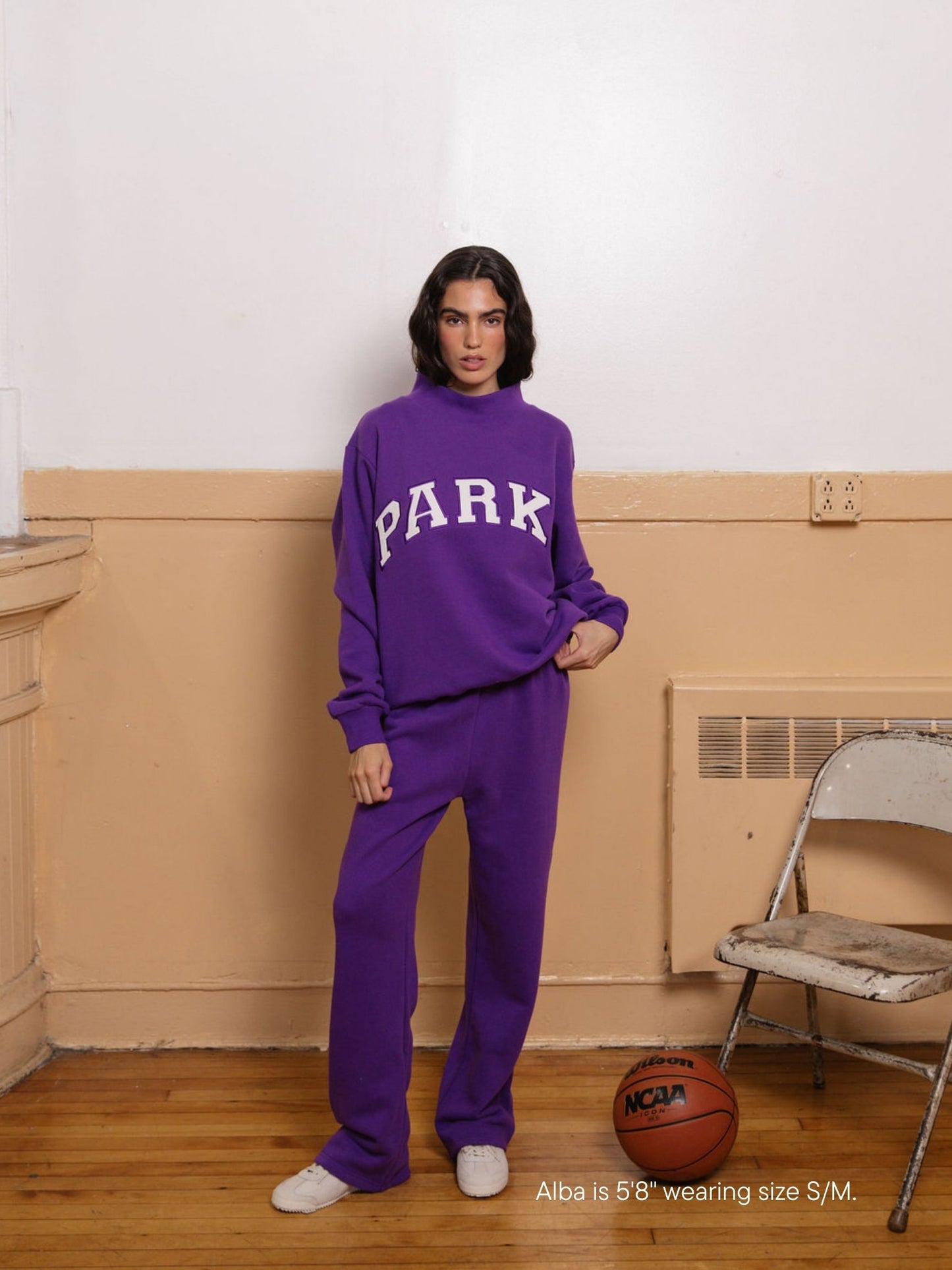 girl wearing back to school varsity mockneck -amethyst + white