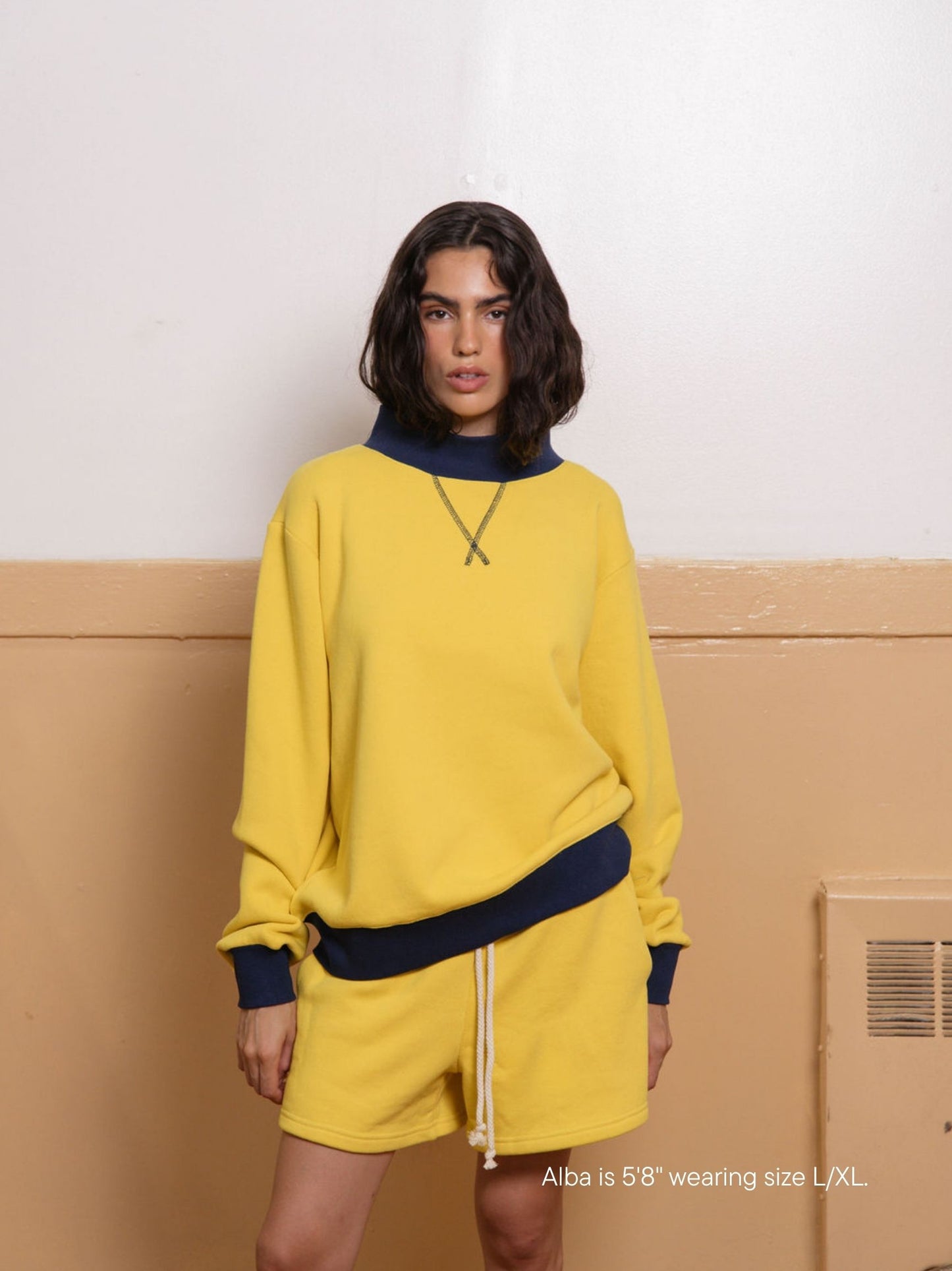 girl wearing two tone classic mockneck -maize + denim