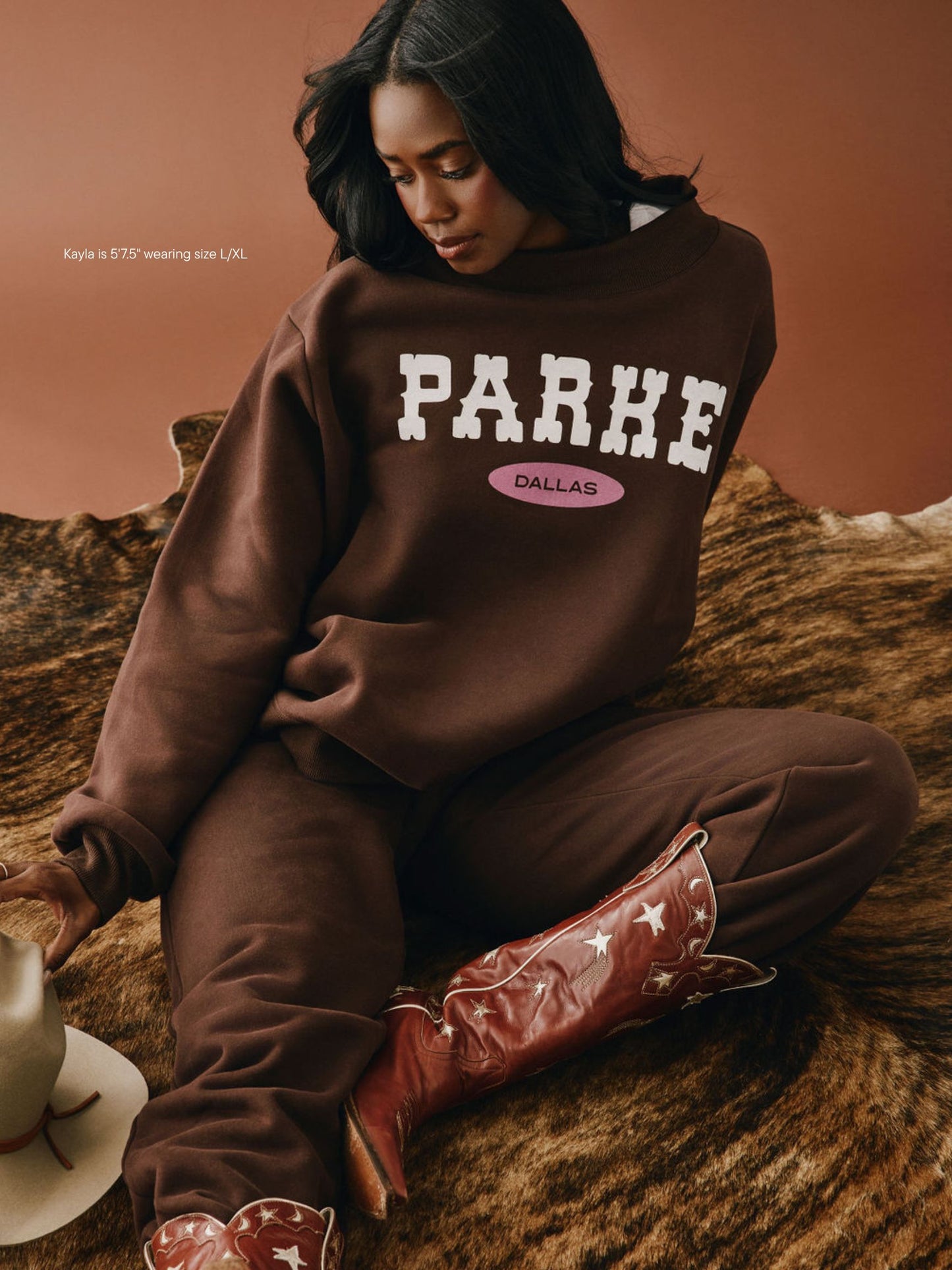 girl wearing Cities Signature Mockneck -cowboy dallas