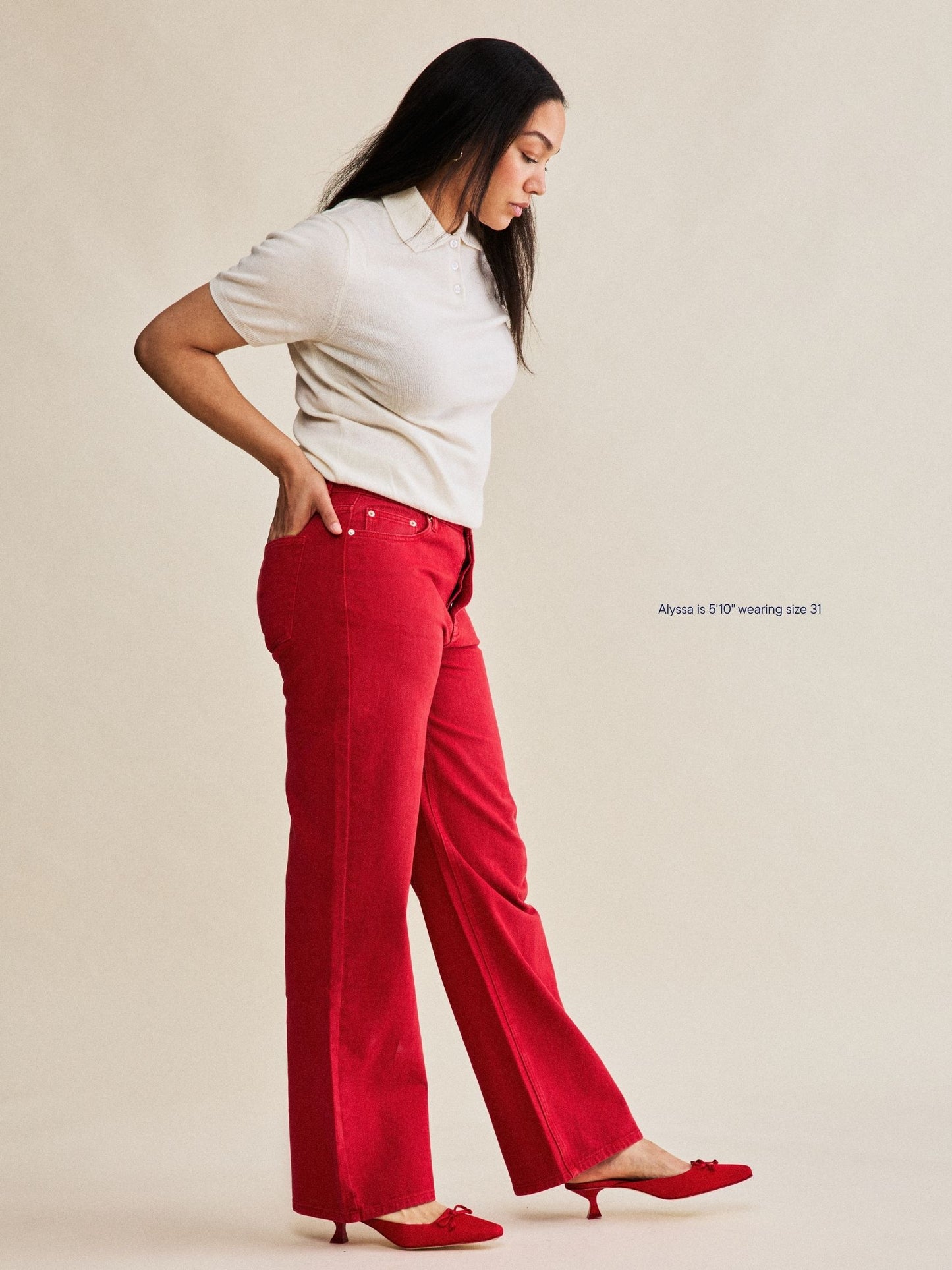 girl wearing classic straight jeans -washed red