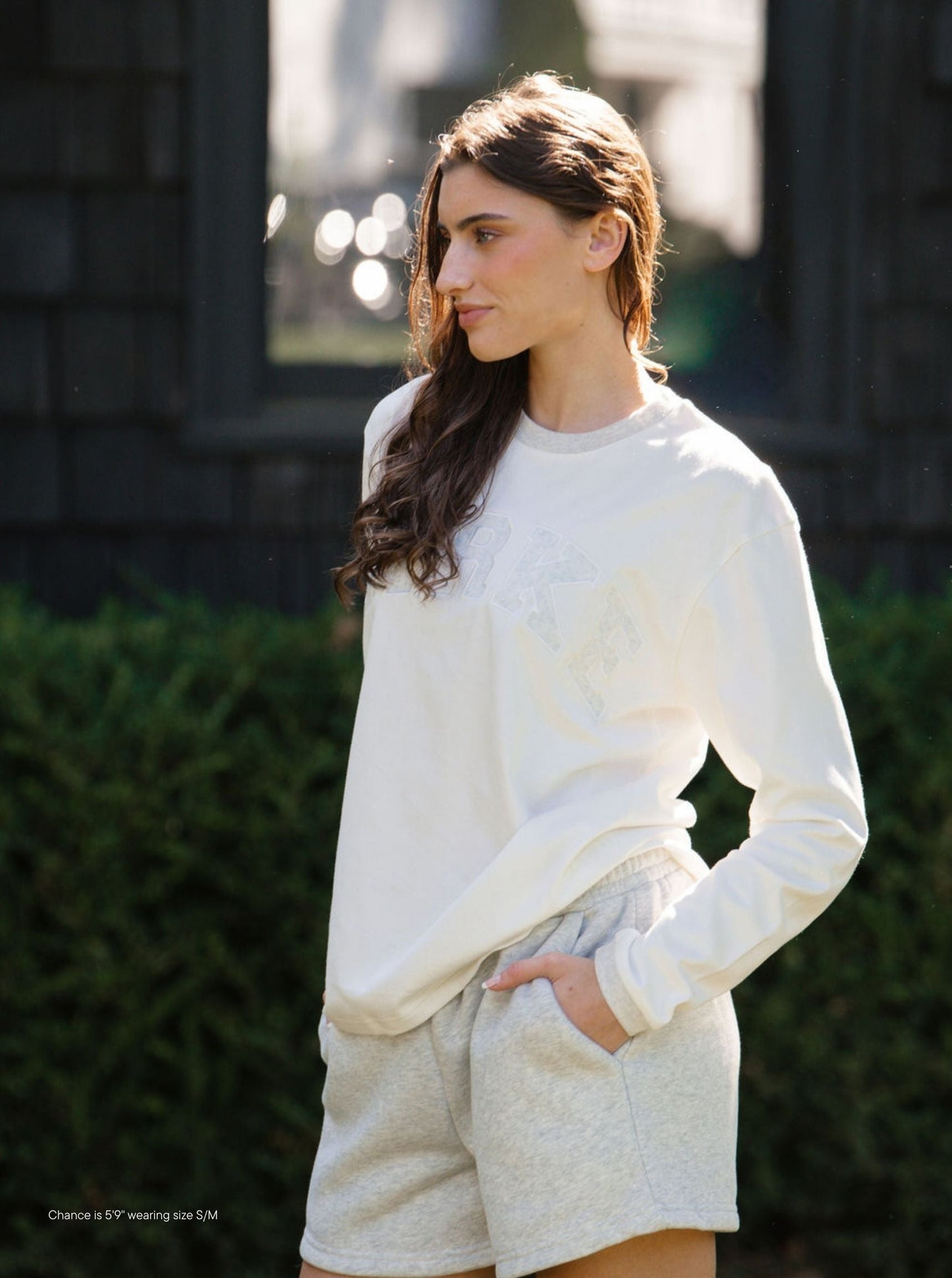 girl wearing varsity long sleeve -classic grey