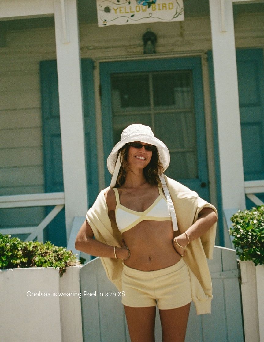 girl wearing heritage mini sweatshorts -peel