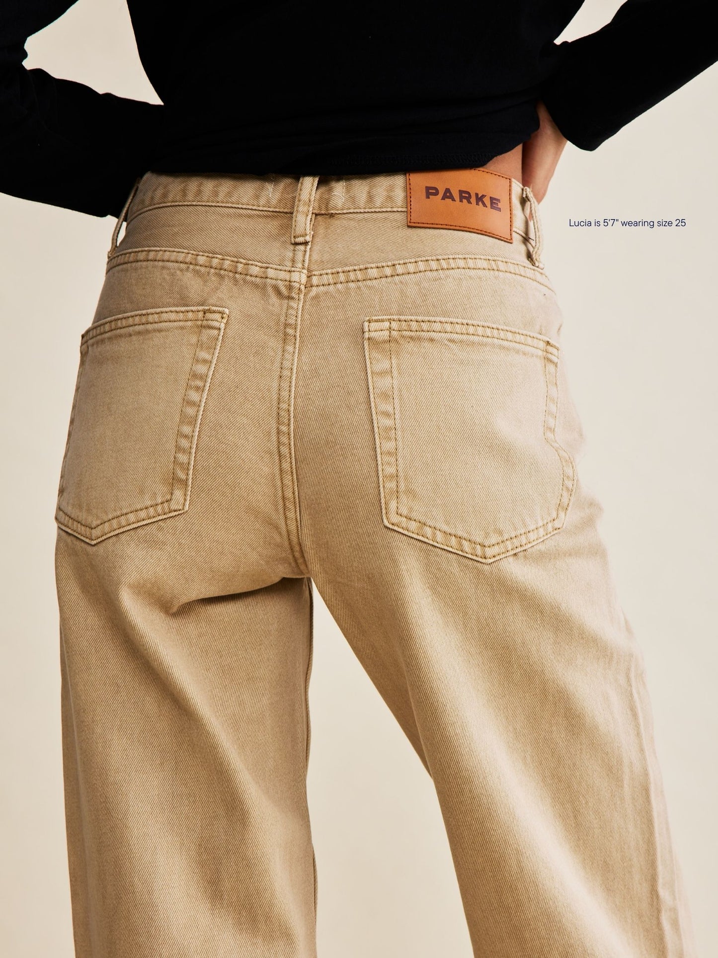 girl wearing classic straight jeans -camel