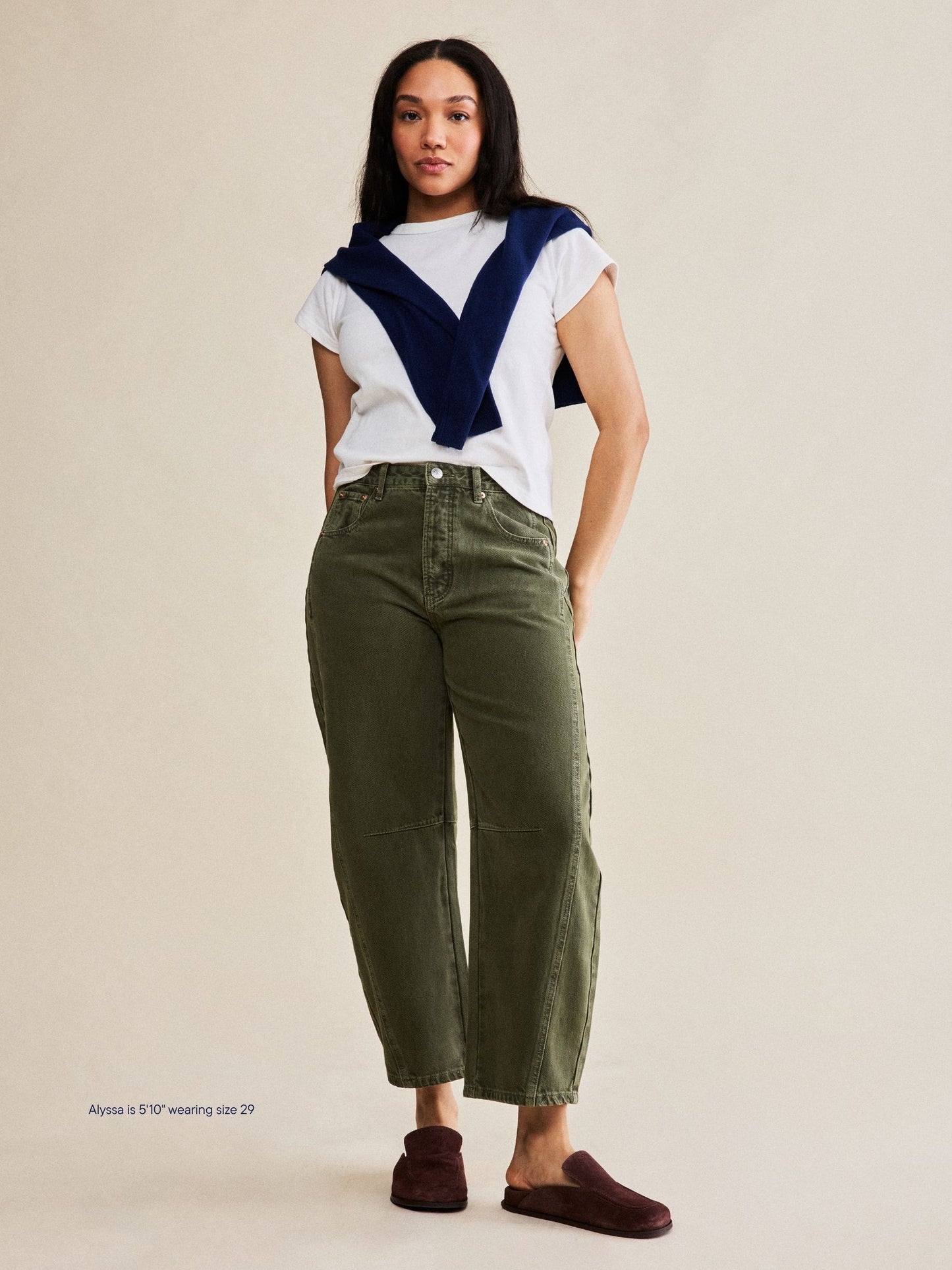 girl wearing horseshoe jeans -olive