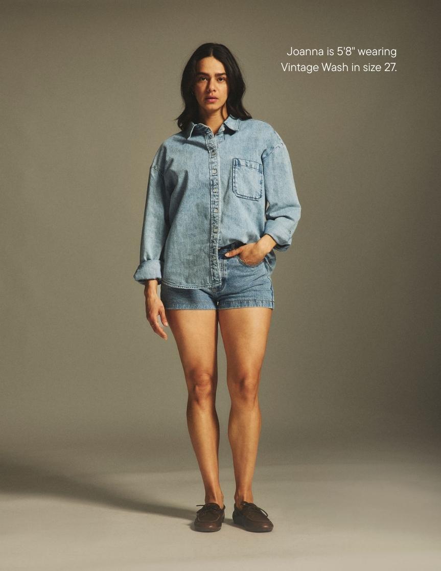girl wearing denim mini shorts -vintage wash