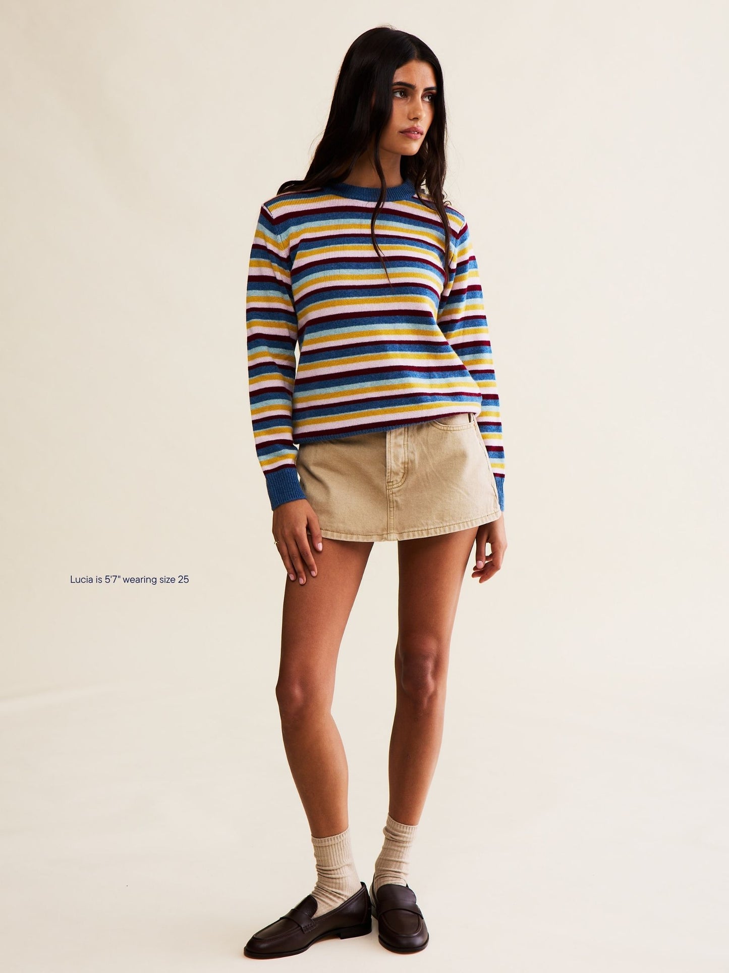 girl wearing denim mini skirt -camel