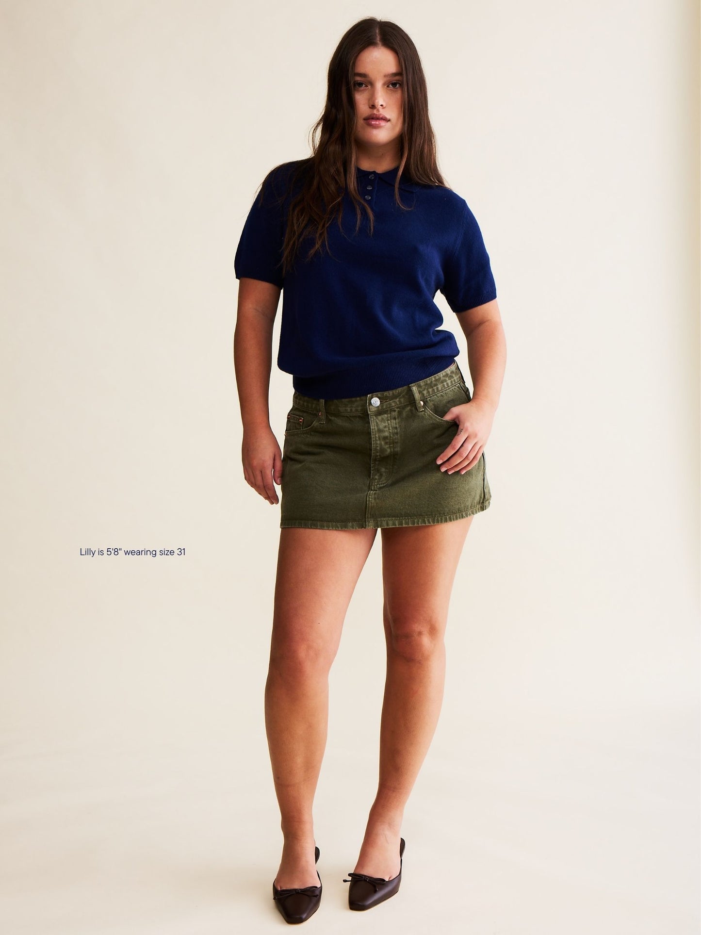 girl wearing denim mini skirt -olive