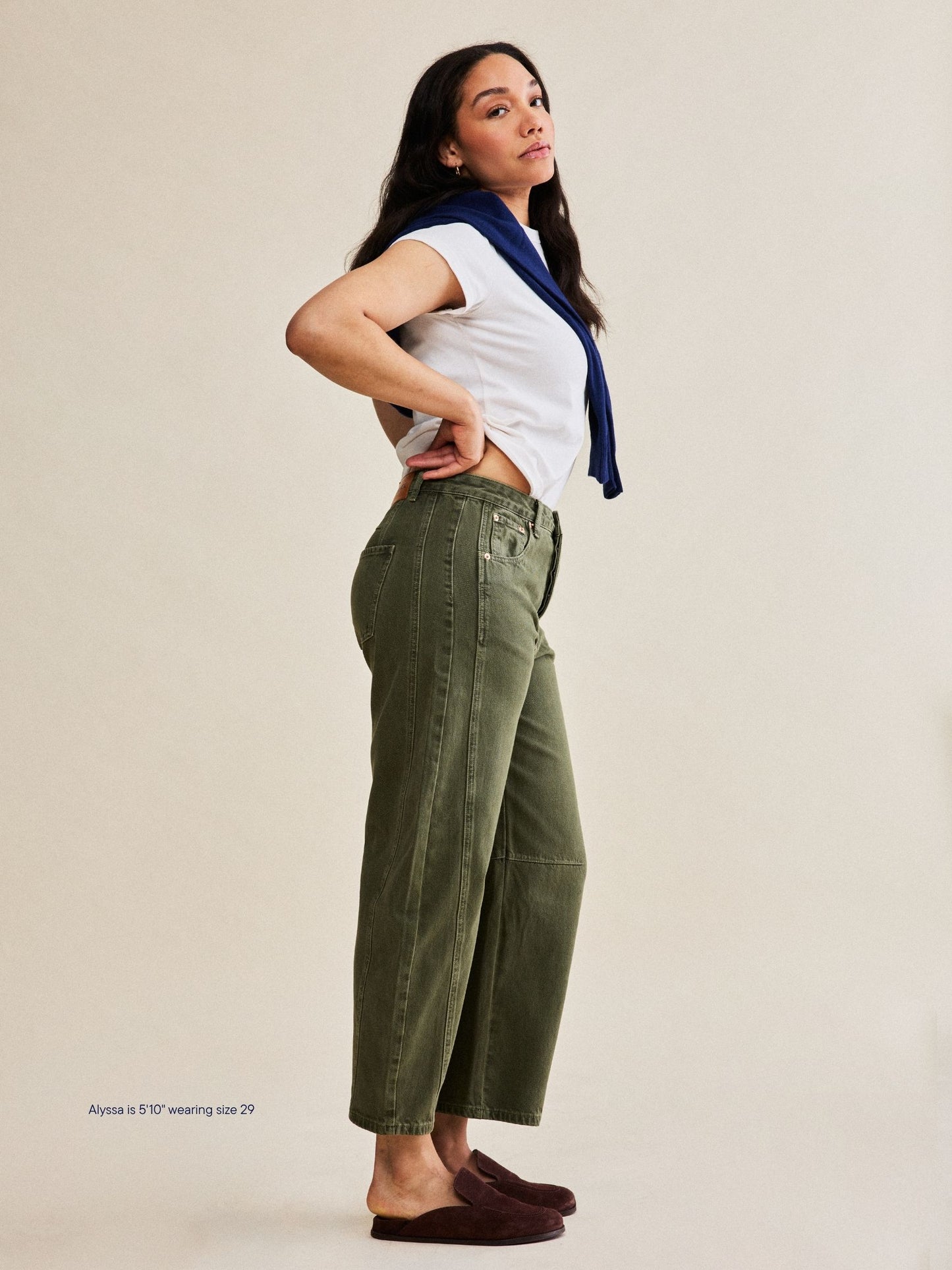 girl wearing horseshoe jeans -olive