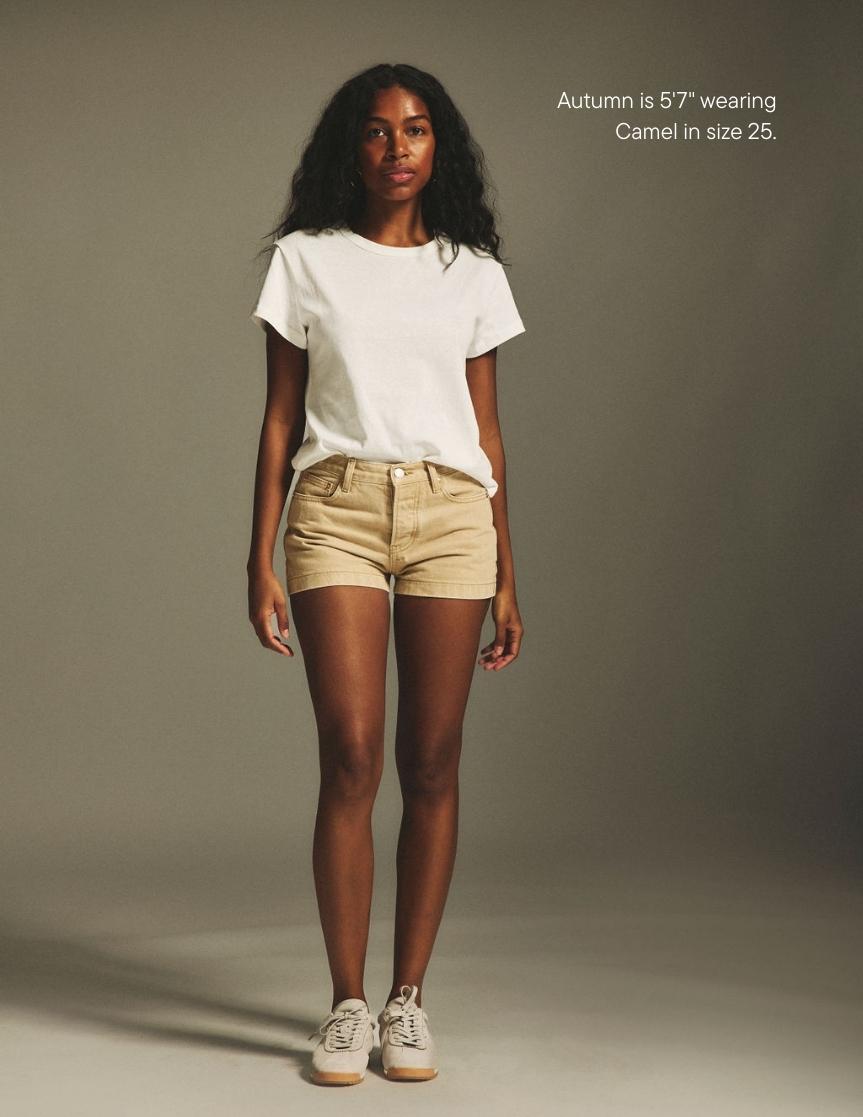 girl wearing denim mini shorts -camel