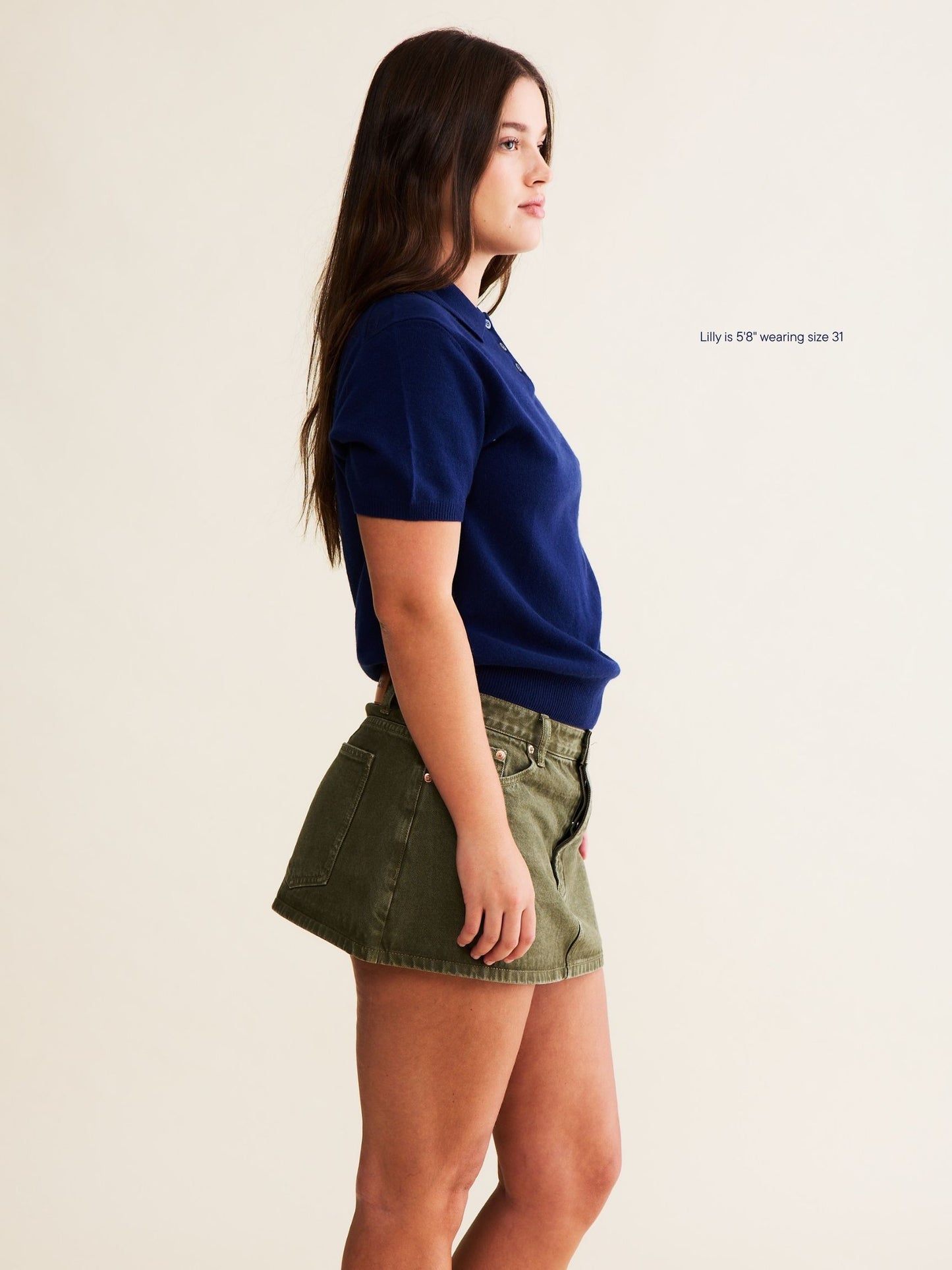 girl wearing med wash denim mini skirt - olive