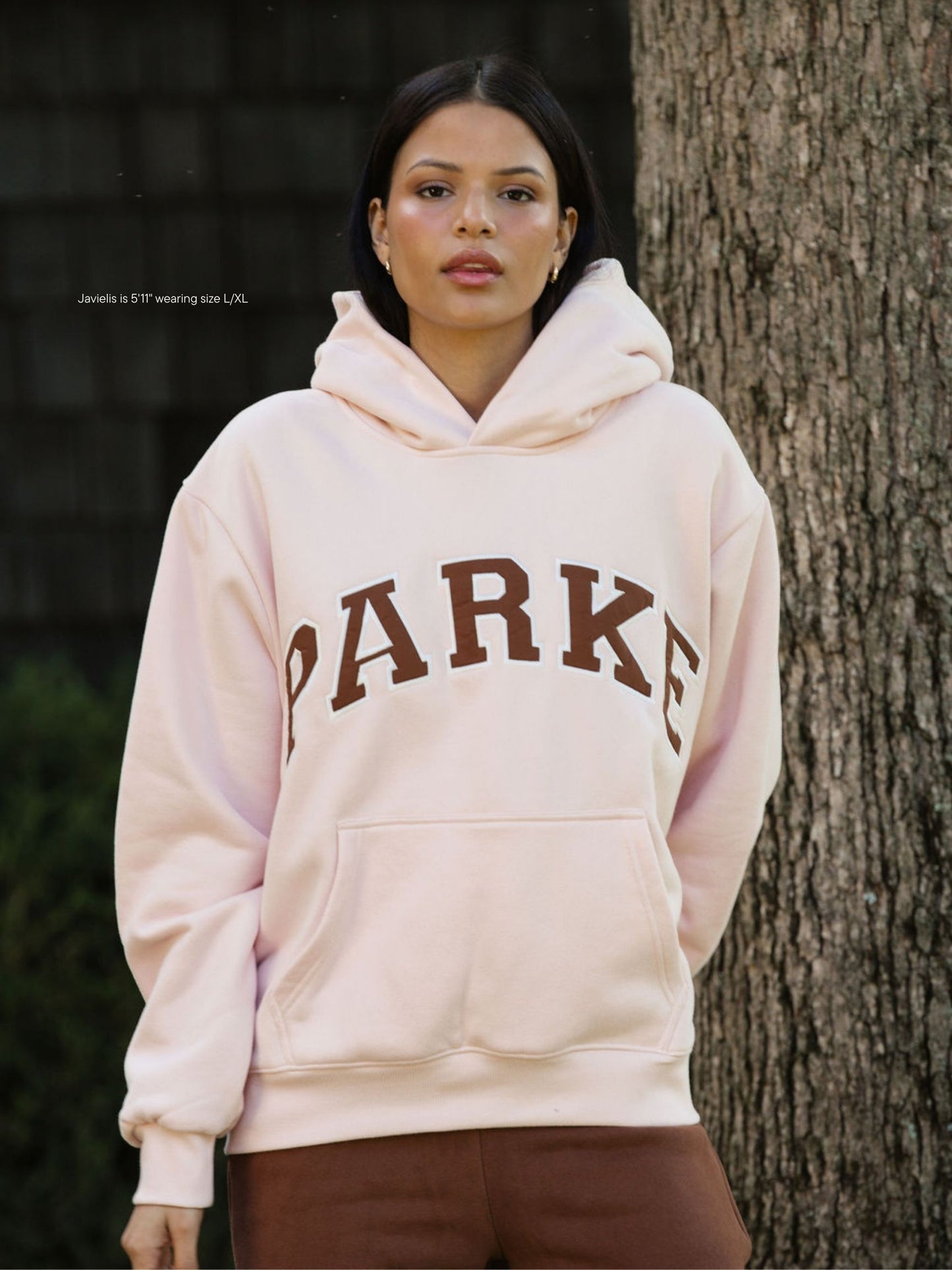 girl wearing varsity hoodie sweatshirt -rose + mocha