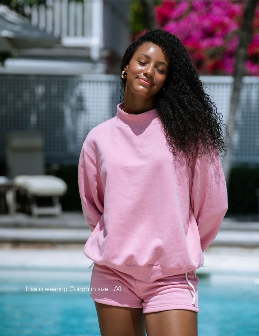girl wearing heritage classic mockneck -conch