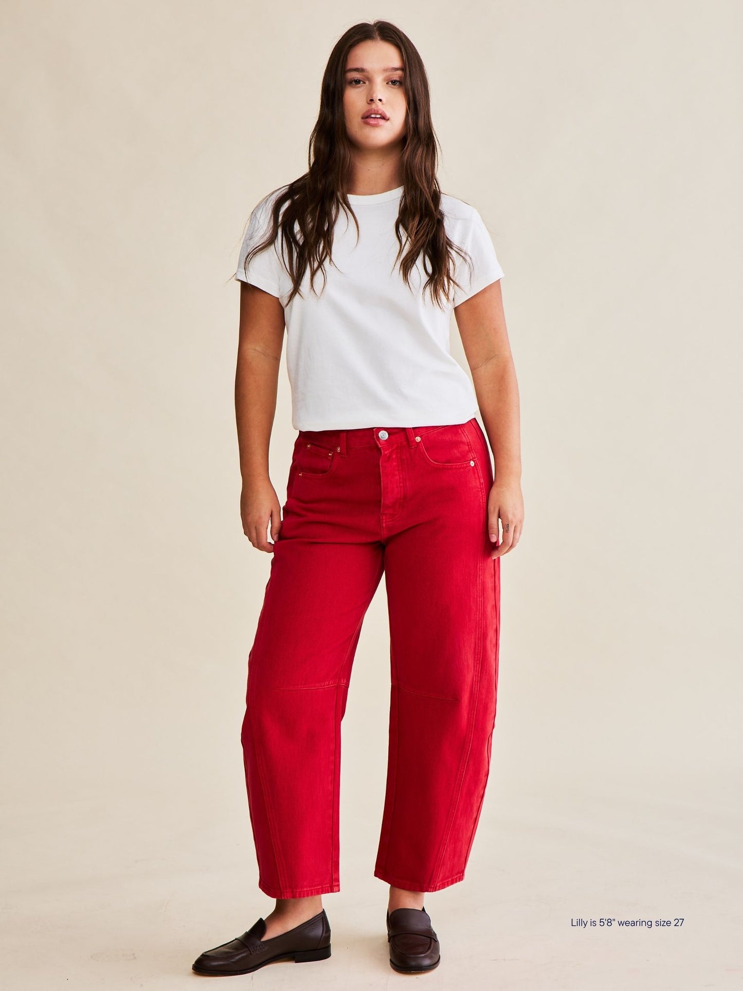 girl wearing horseshoe jeans -washed red