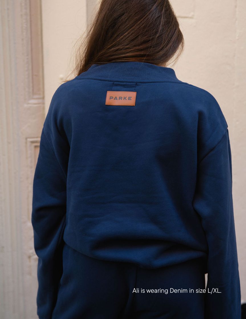 girl wearing classic mockneck -denim