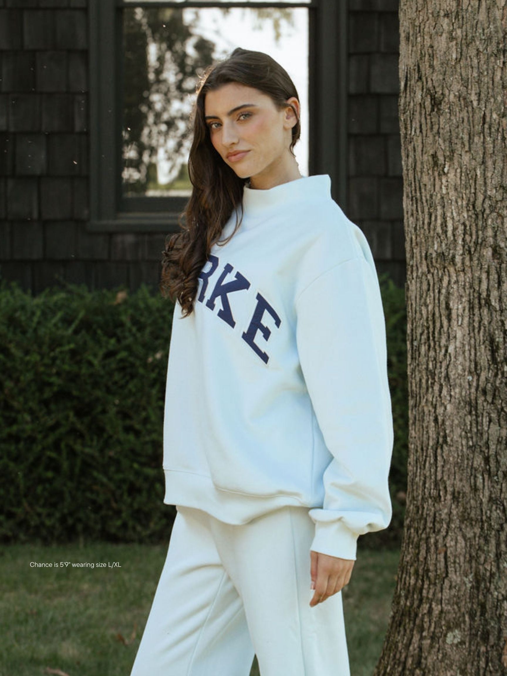 girl wearing hometown varsity mockneck flat -cloud + crown blue