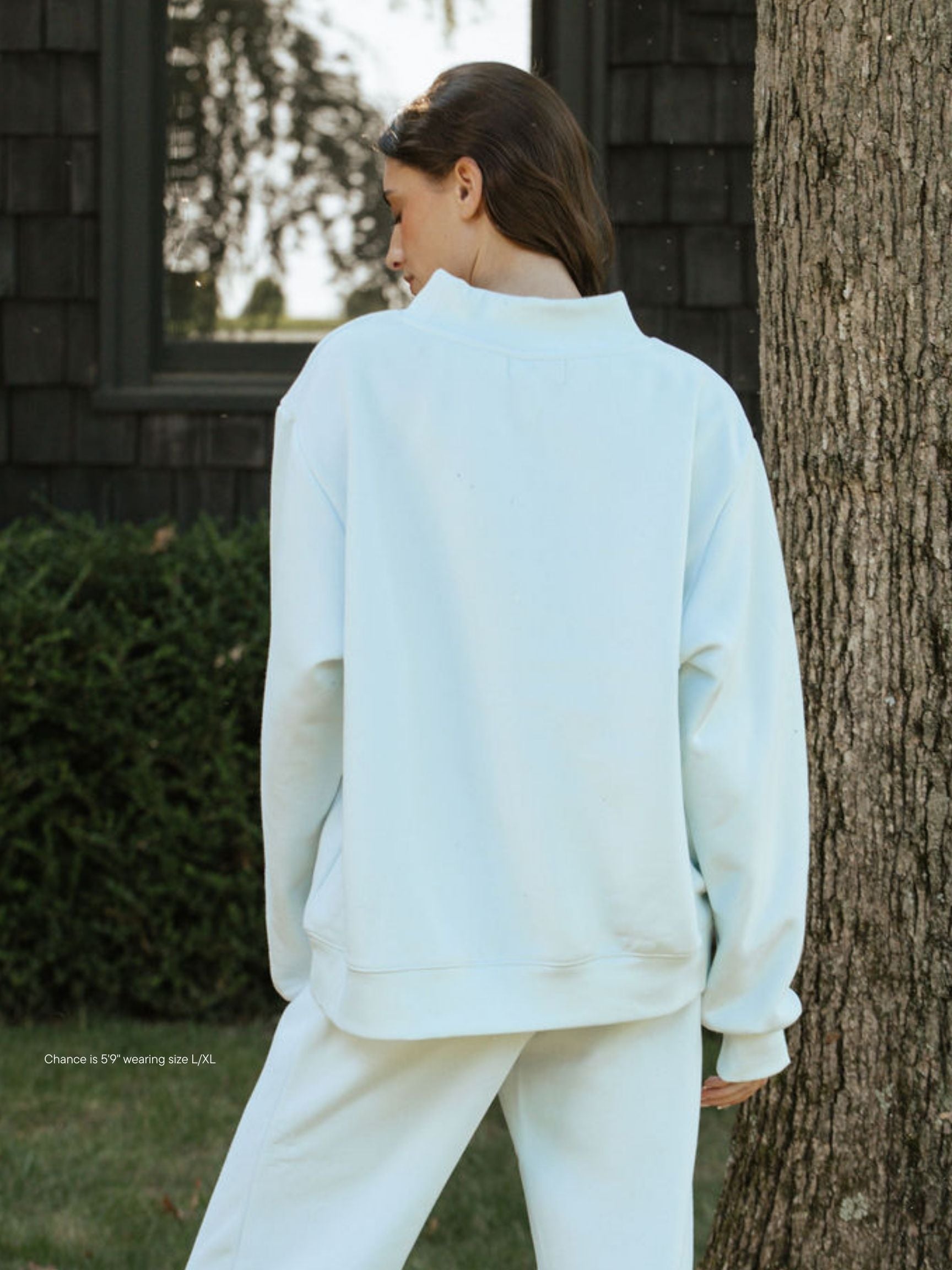 girl wearing hometown varsity mockneck flat -cloud + crown blue