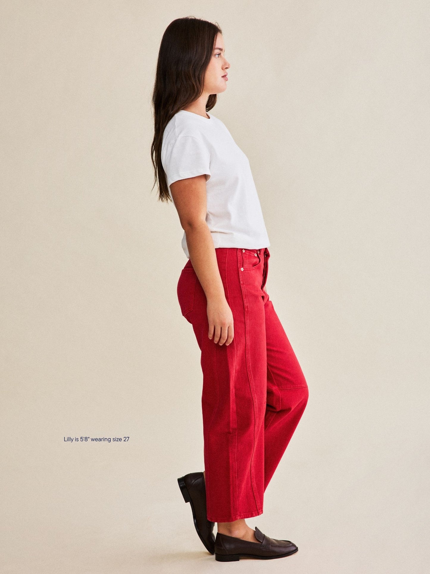 girl wearing horseshoe jeans -washed red