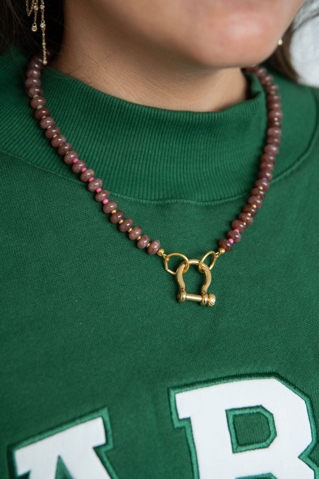 girl wearing spicy dan necklace -chocolate