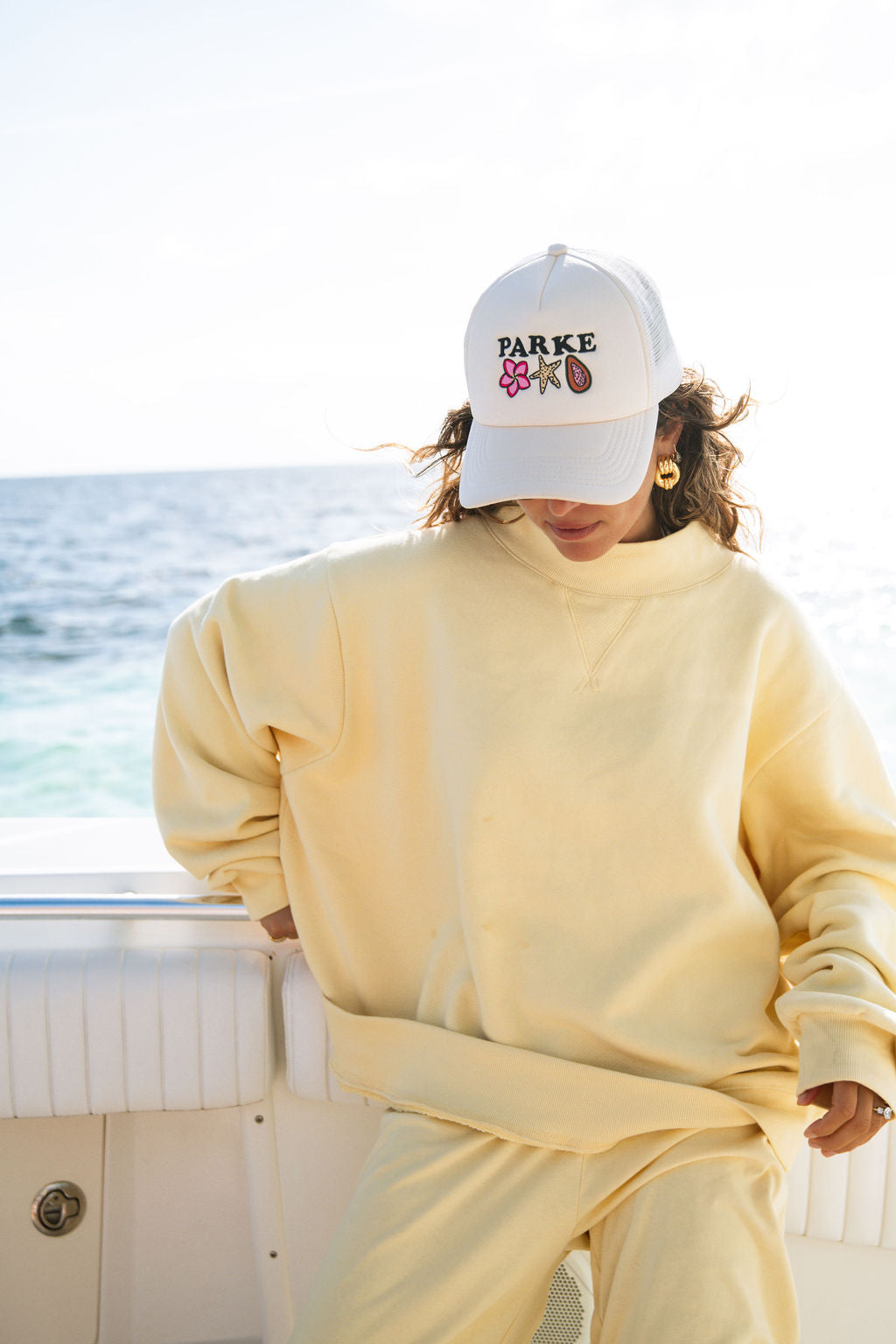 girl wearing summerland hat -cream
